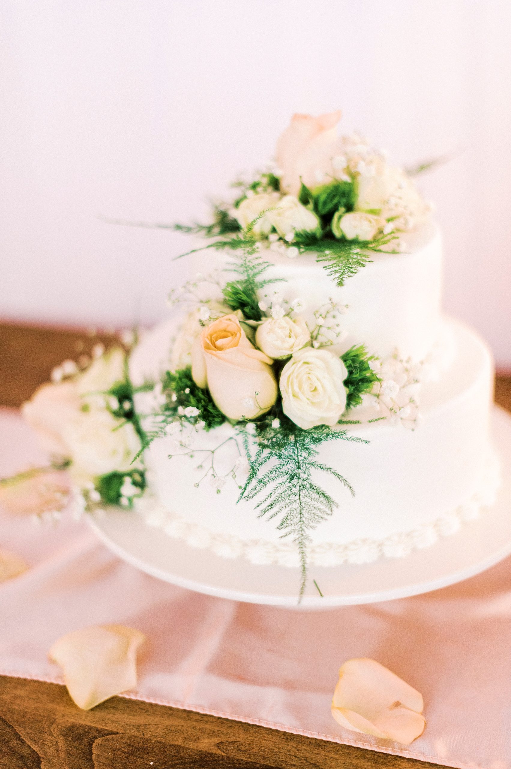 tiered wedding cake with flowers for NC wedding reception