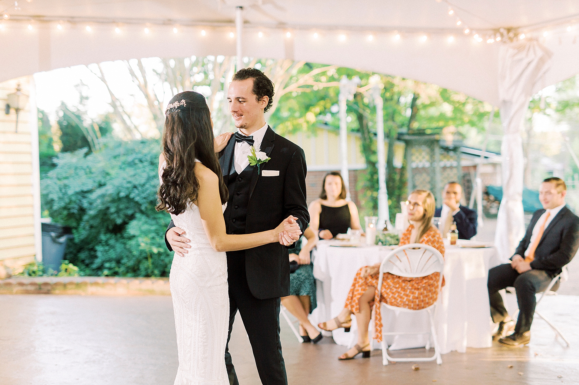 bride and groom dance together during NC wedding reception