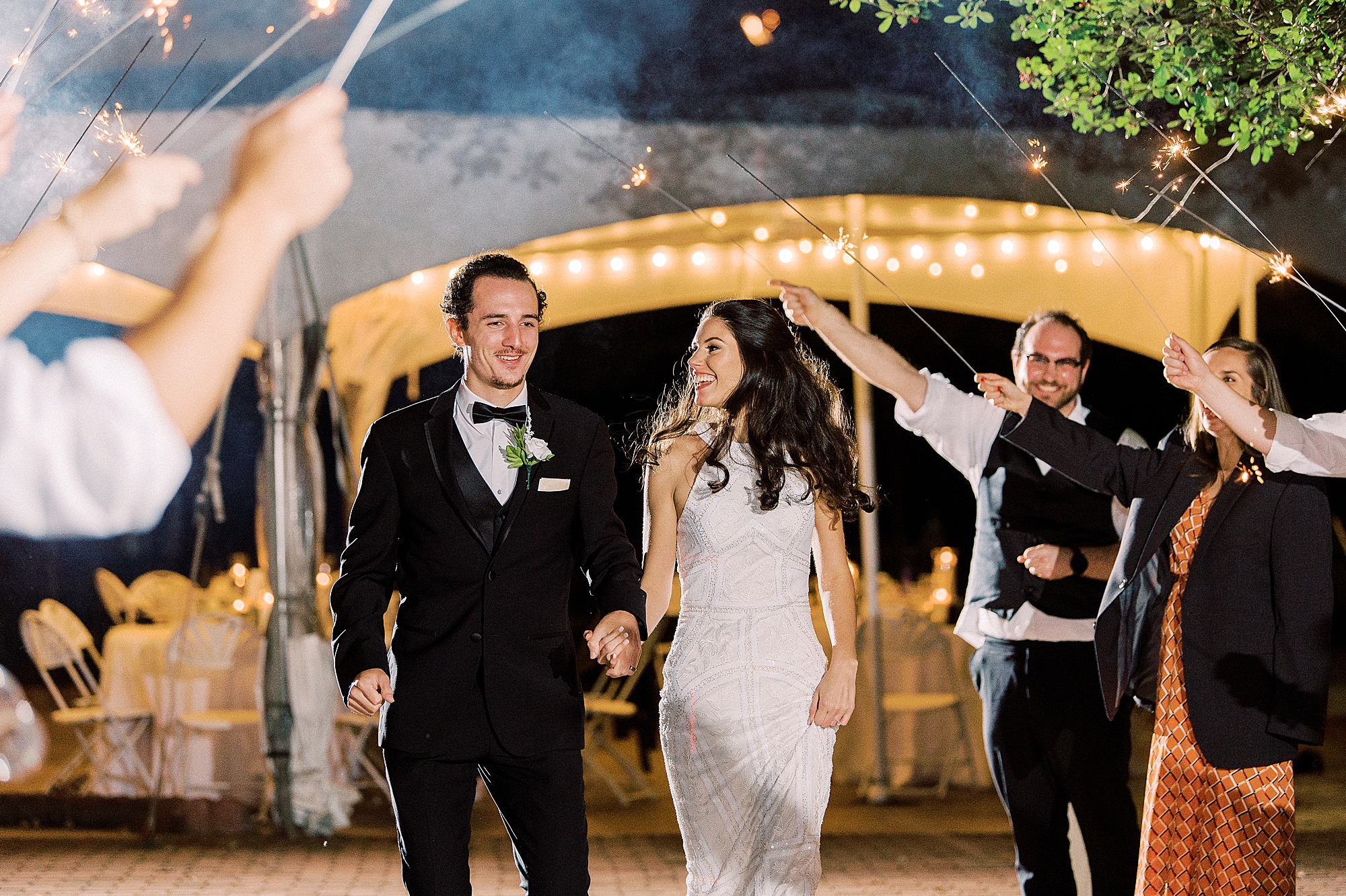 newlyweds leave wedding reception during sparkler exit
