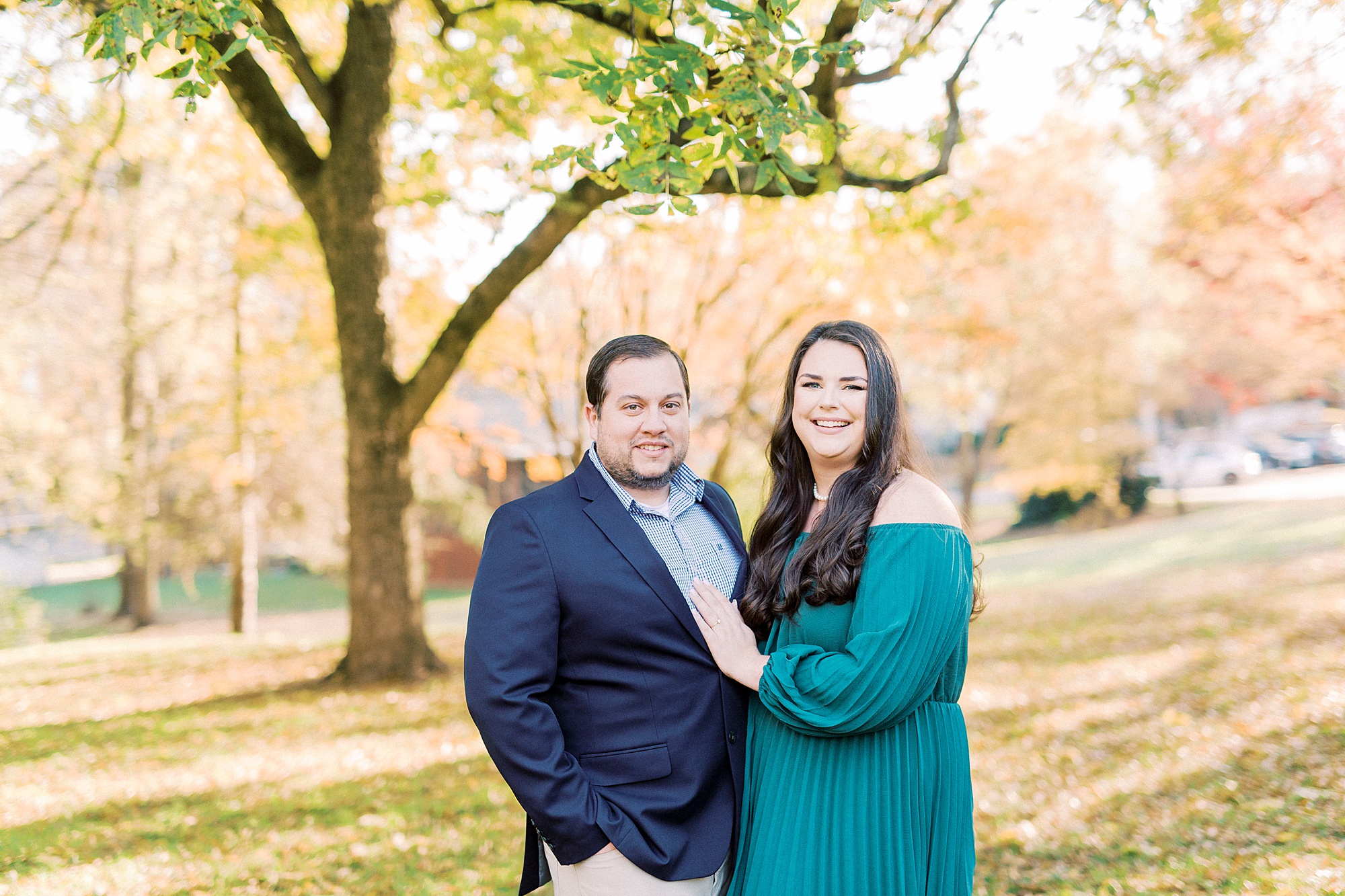 couple hugs during fall Downtown Davidson engagement session