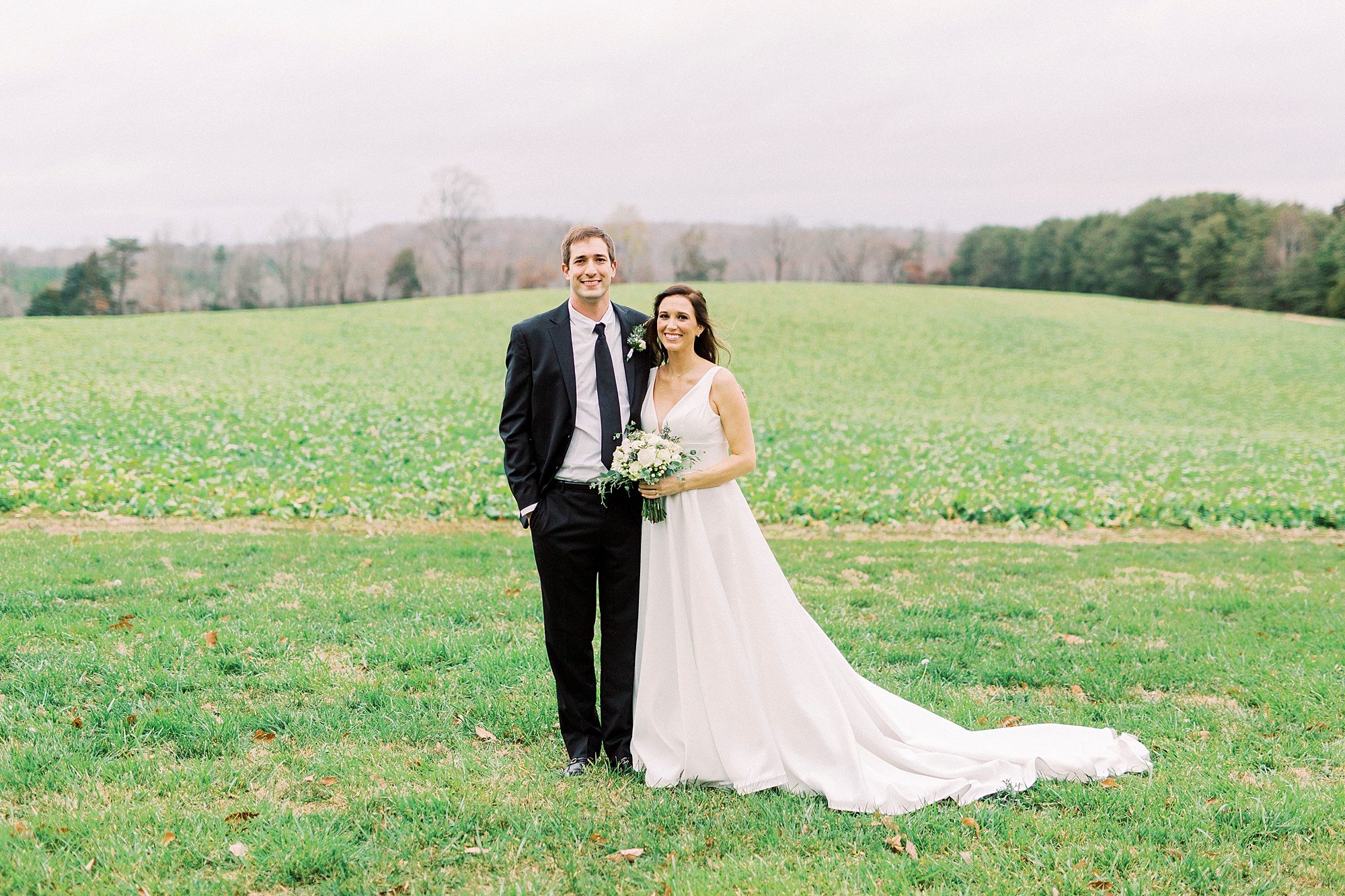 newlyweds pose on family farm in Bedford VA