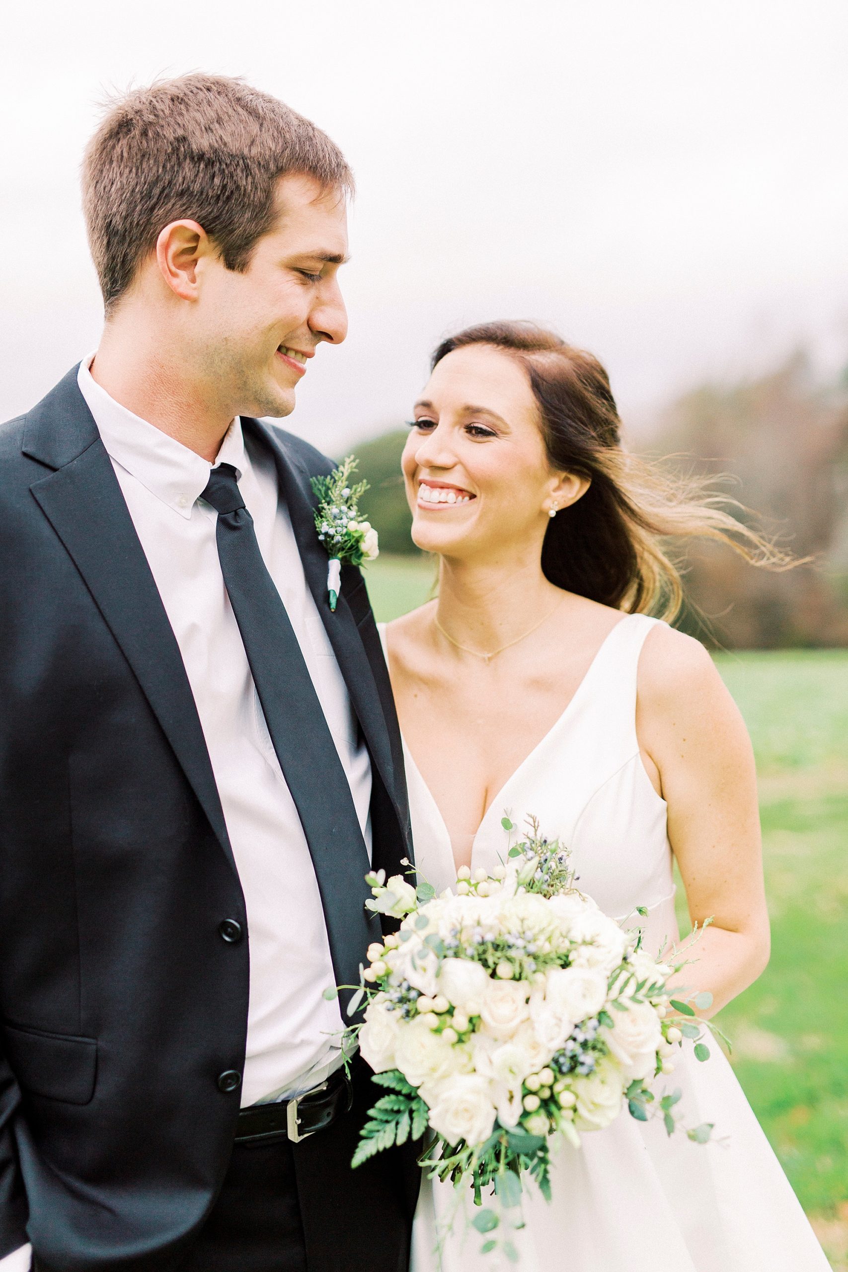 bride and groom smile together during VA wedding portraits