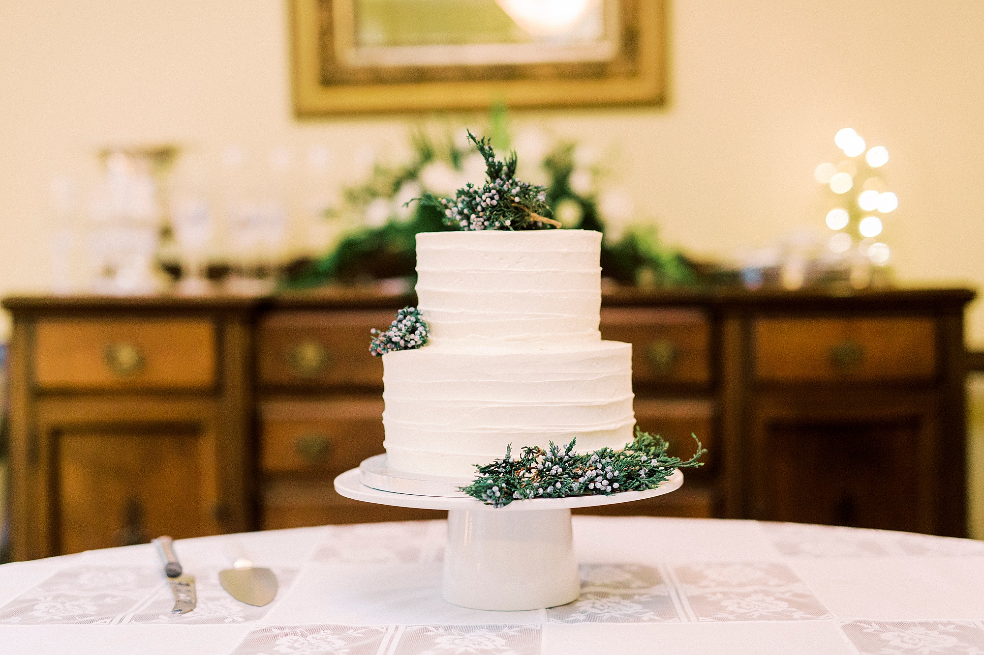 tiered wedding cake with greenery for romantic winter wedding in Bedford VA