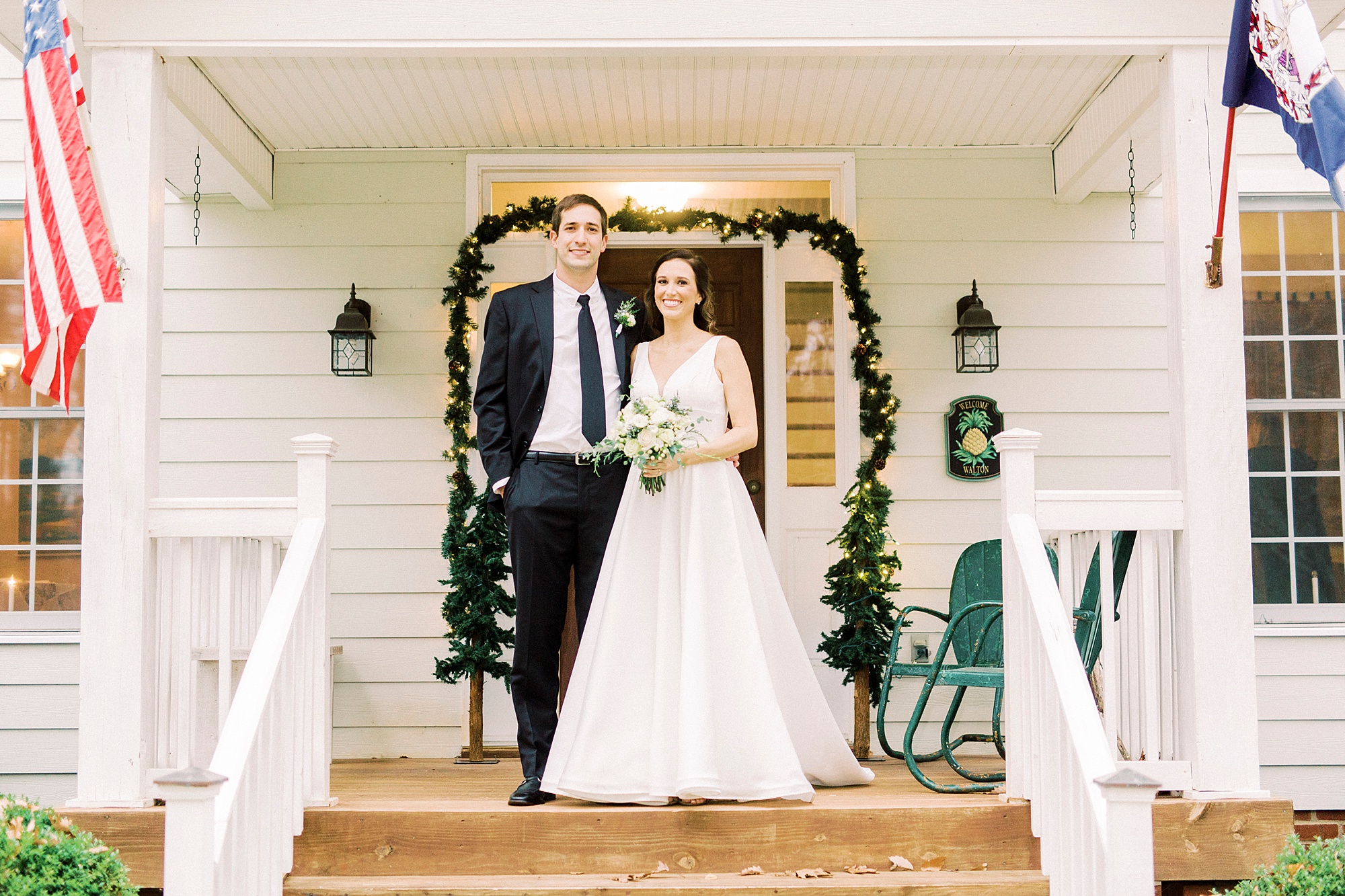 bride and groom pose on steps of home in Bedford VA