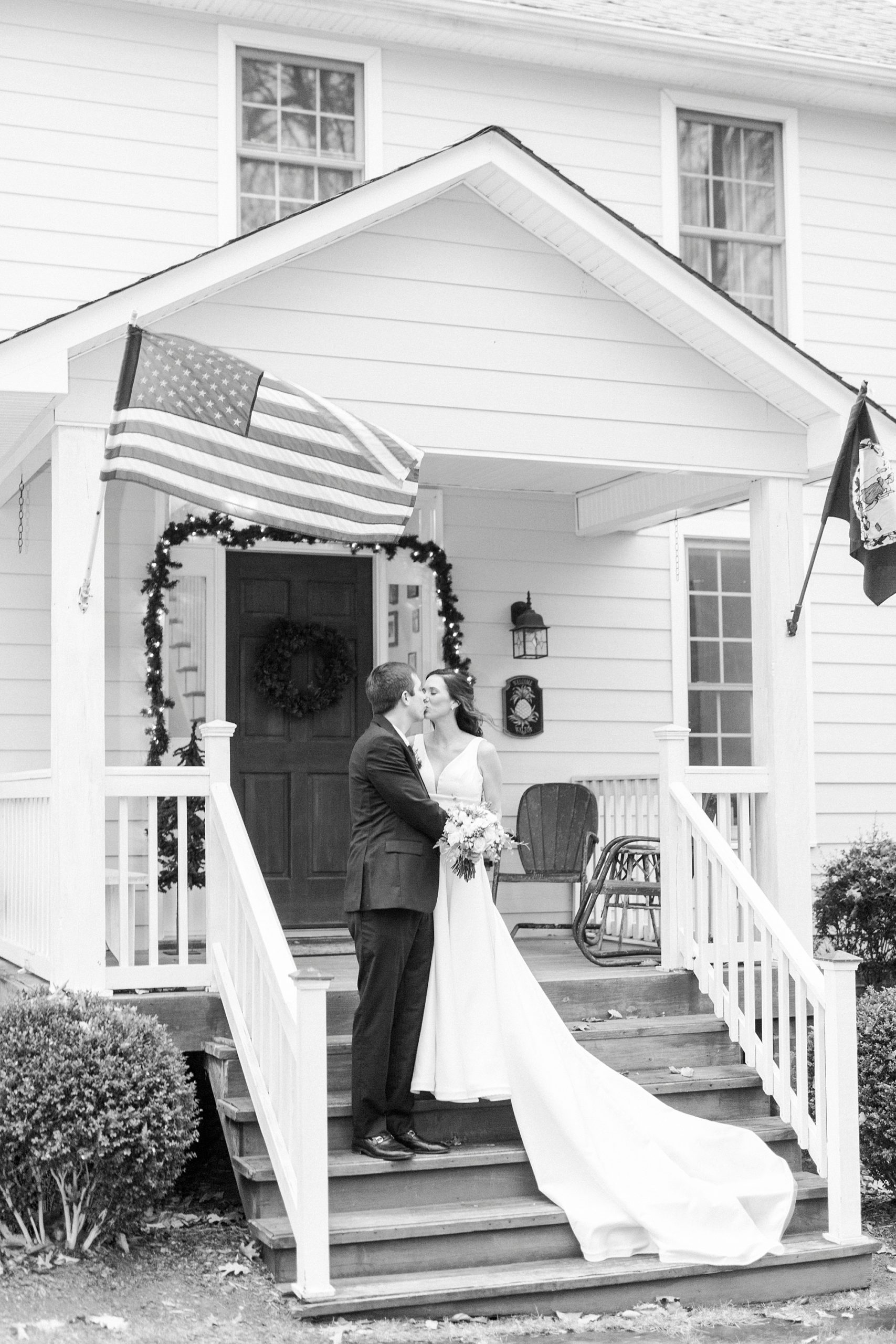 newlyweds stand on steps of home in Bedford VA