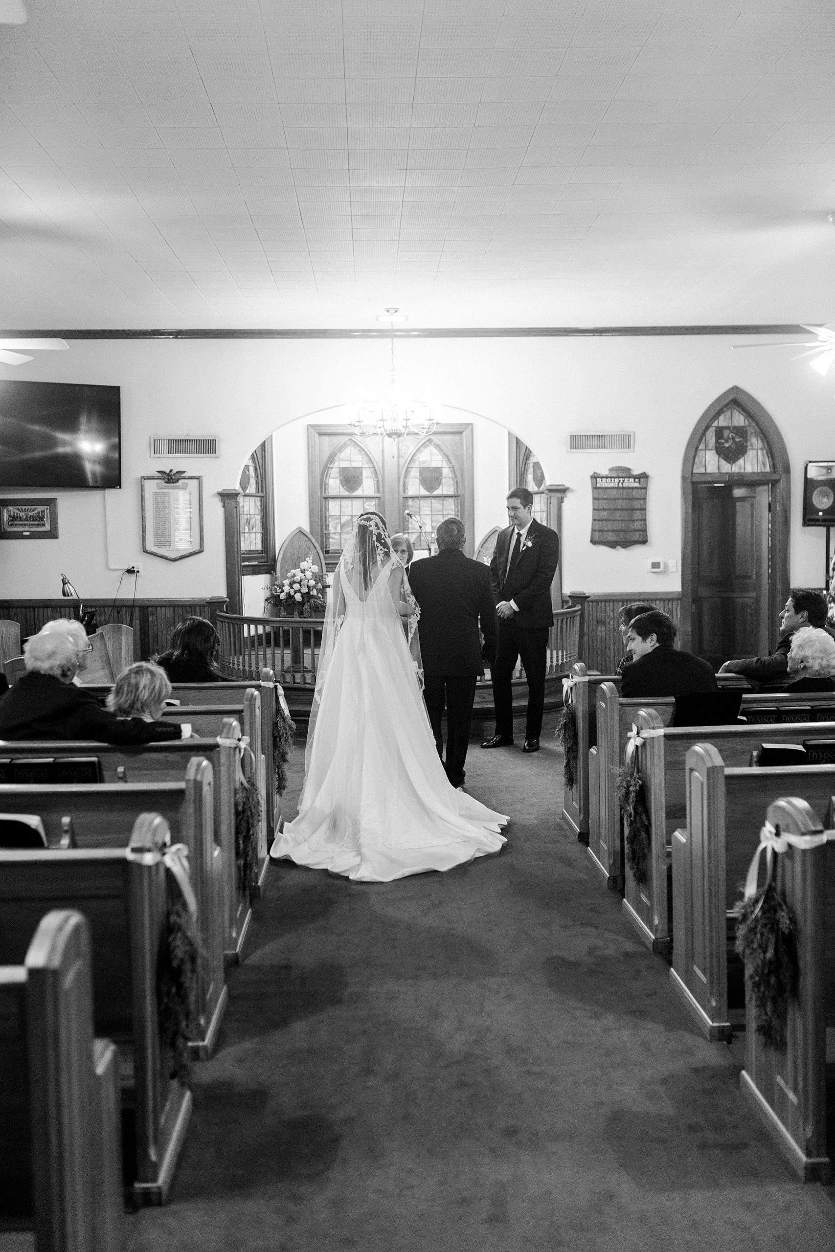 bride and father walk up aisle for intimate church wedding at Bethesda United Methodist Church