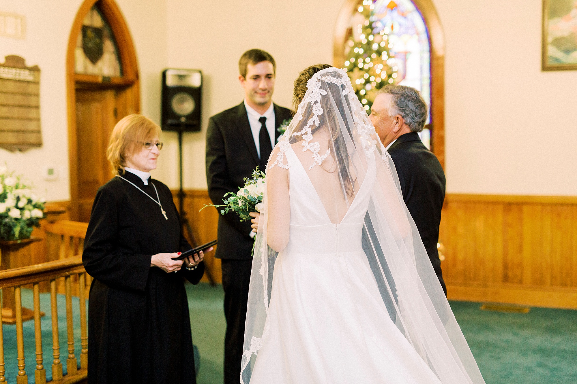newlyweds exchange vows during intimate church wedding at Bethesda United Methodist Church