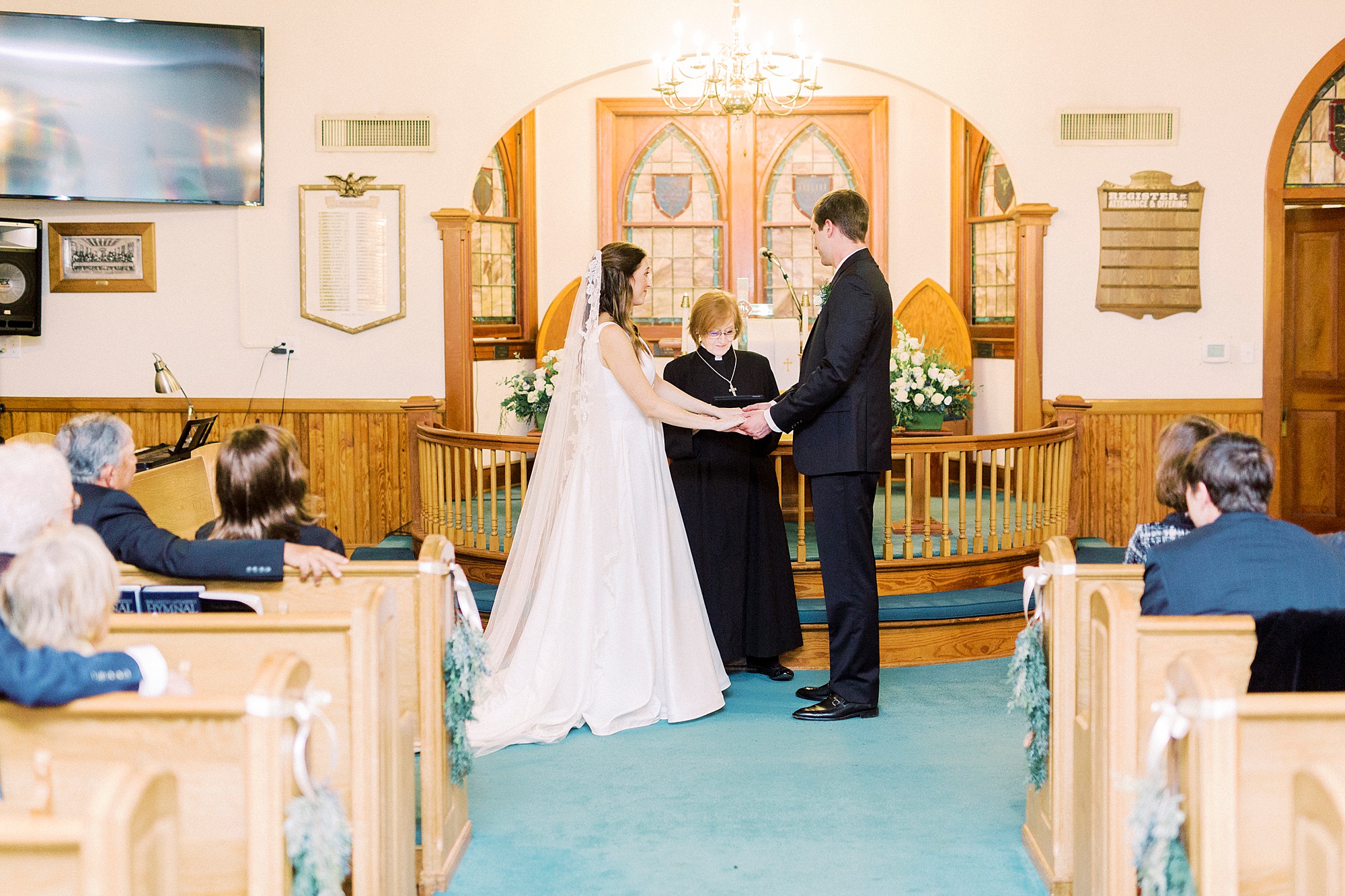 couple exchanges vows during intimate church wedding at Bethesda United Methodist Church