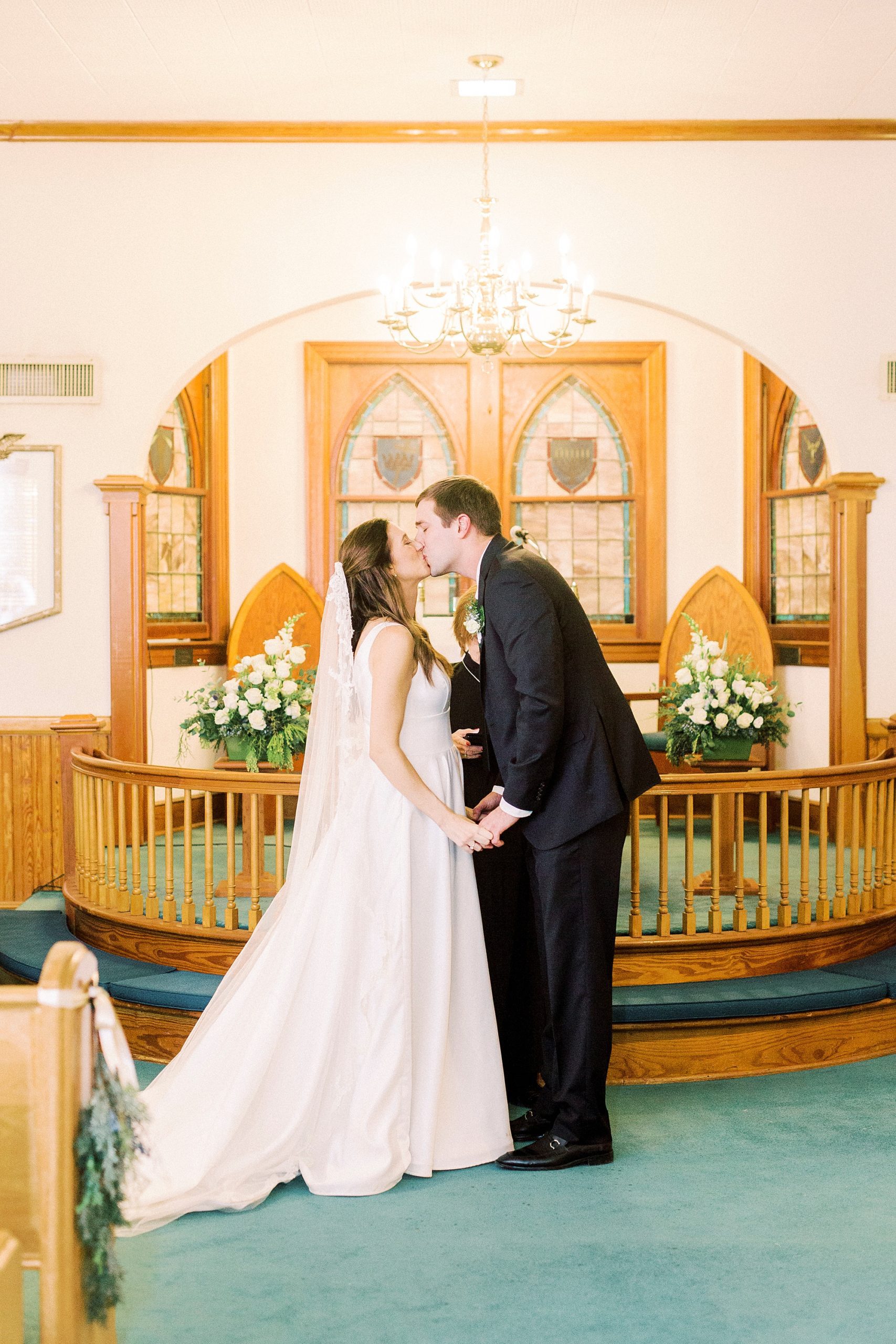 bride and groom kiss after intimate church wedding at Bethesda United Methodist Church