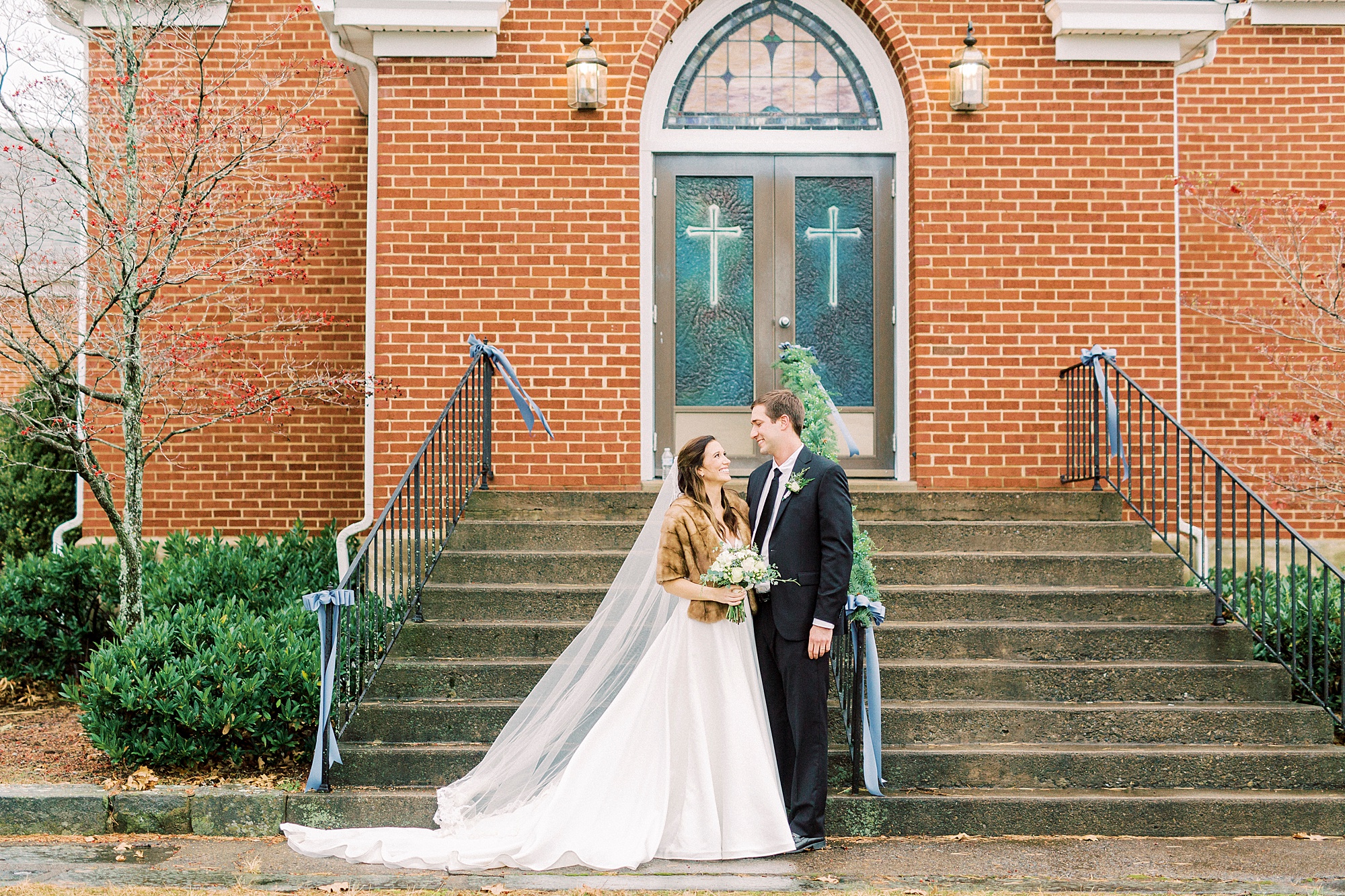newlyweds hug outside Bethesda United Methodist Church