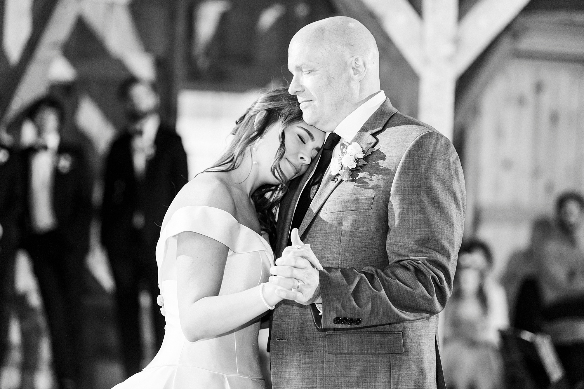 bride cries dancing with father at reception
