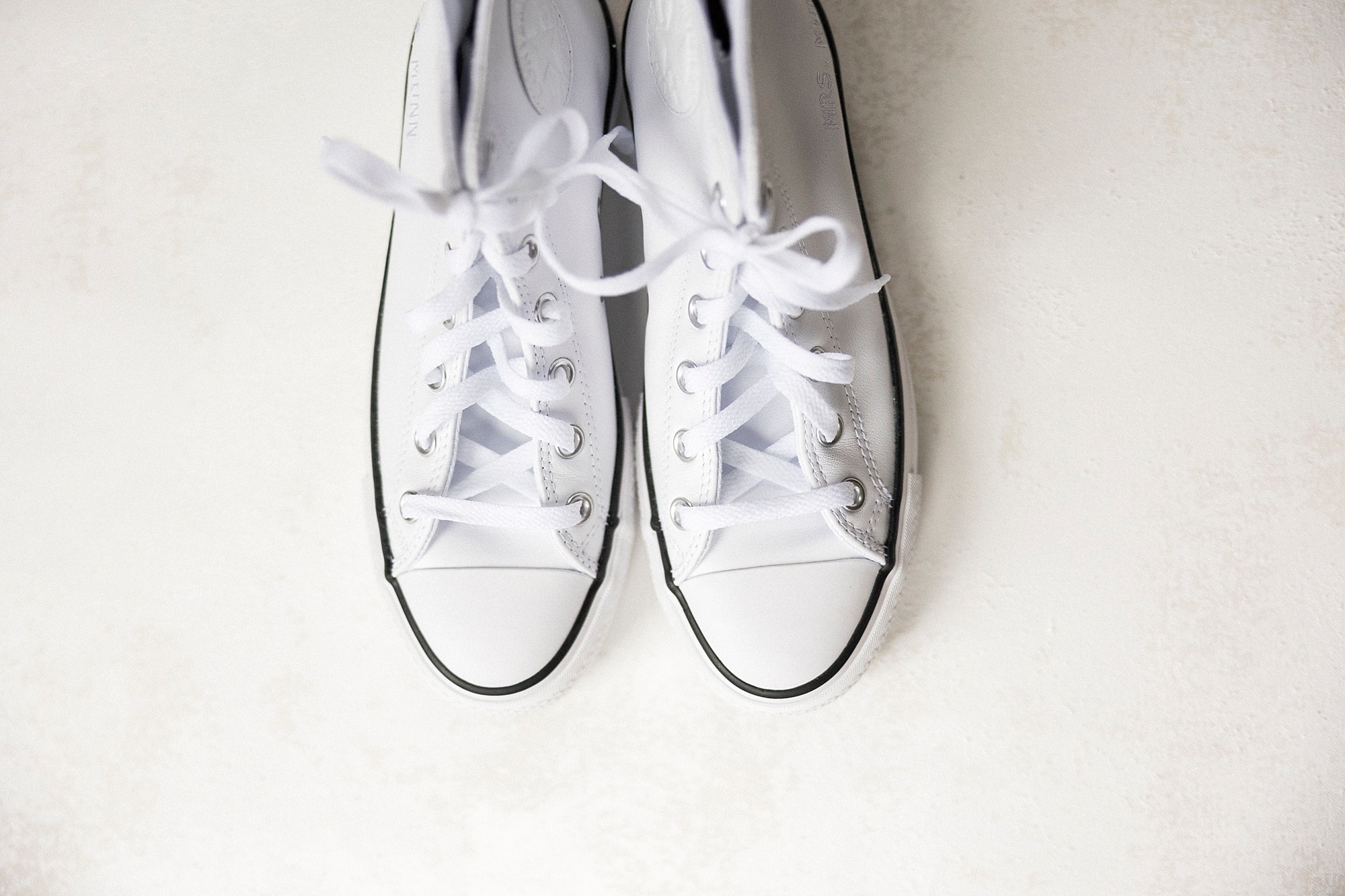 bride's white converse shoes for wedding day