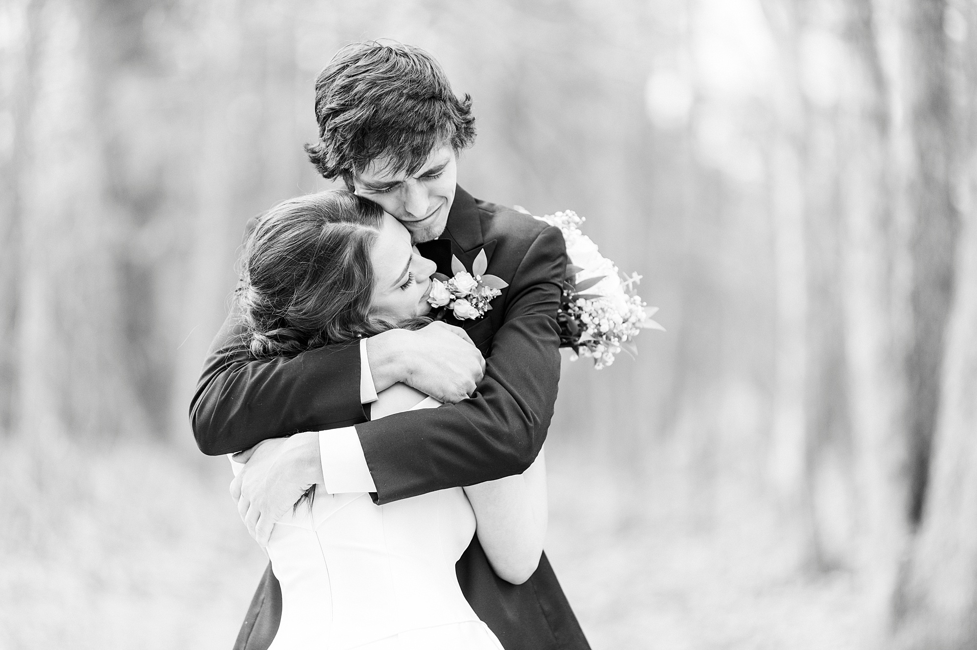 bride hugs brother during first look on wedding day
