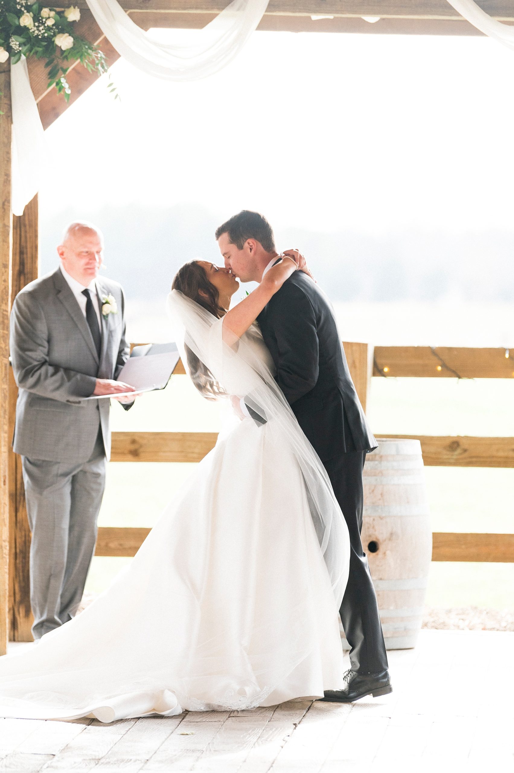 couple kisses after Christ-centered ceremony at The Farm at Brusharbor