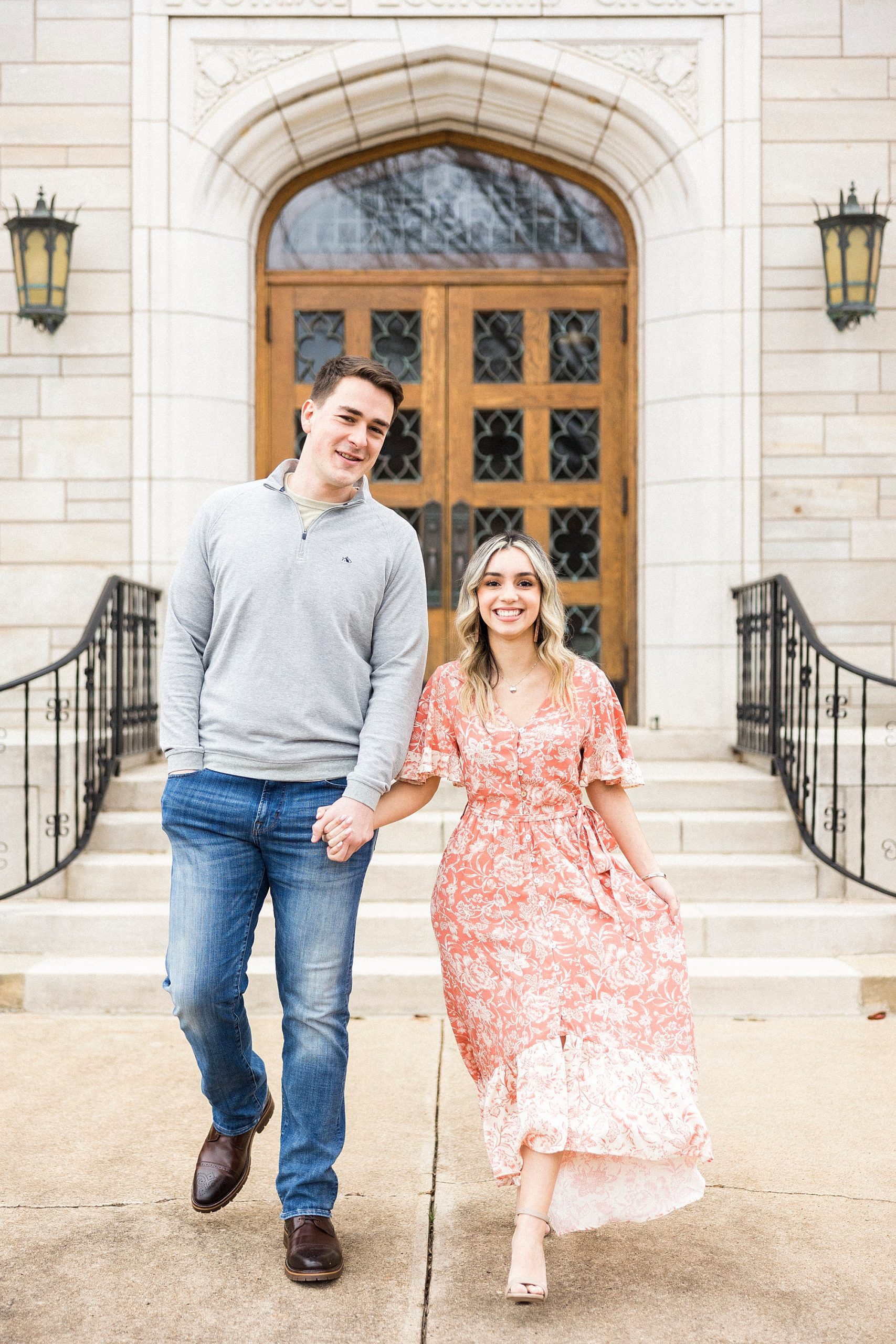 engaged couple walks outside of St. James Lutheran Church