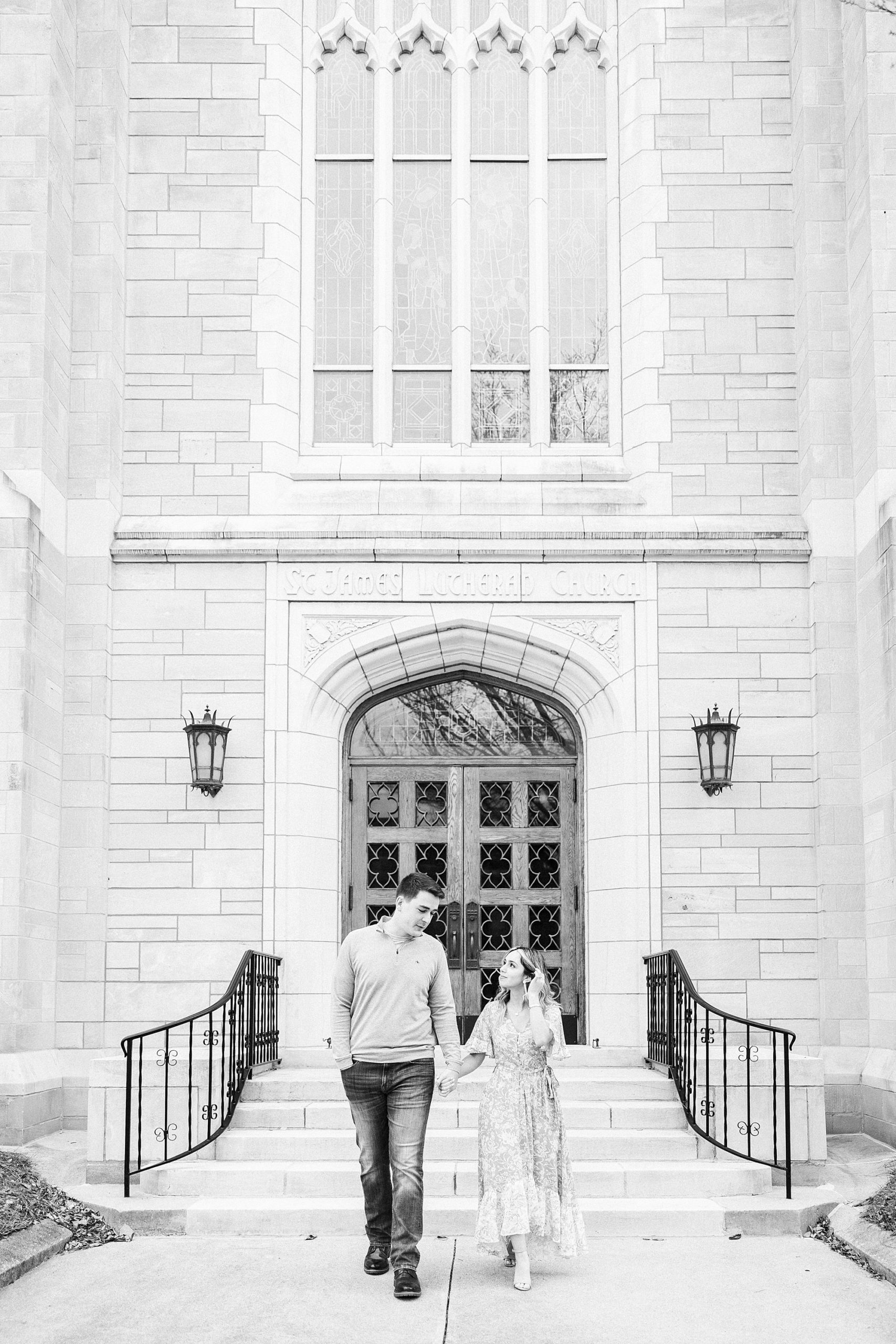 bride and groom pose outside St. James Lutheran Church in Concord NC