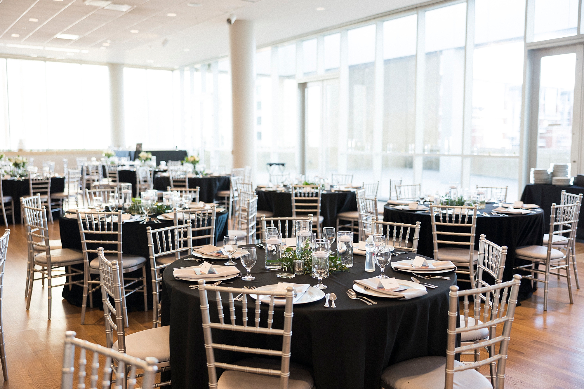 Mint Museum Uptown wedding reception with black and gold details
