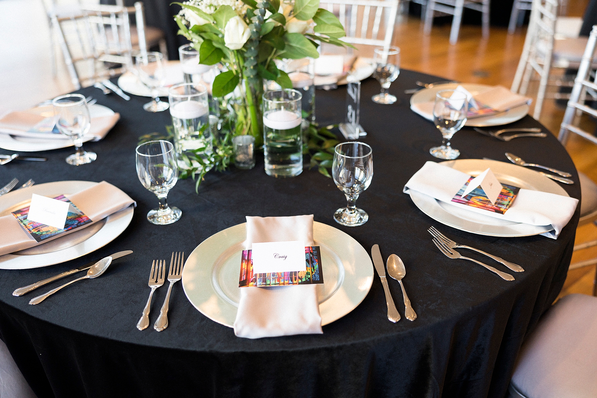 place settings with gold plates at Mint Museum Uptown wedding reception