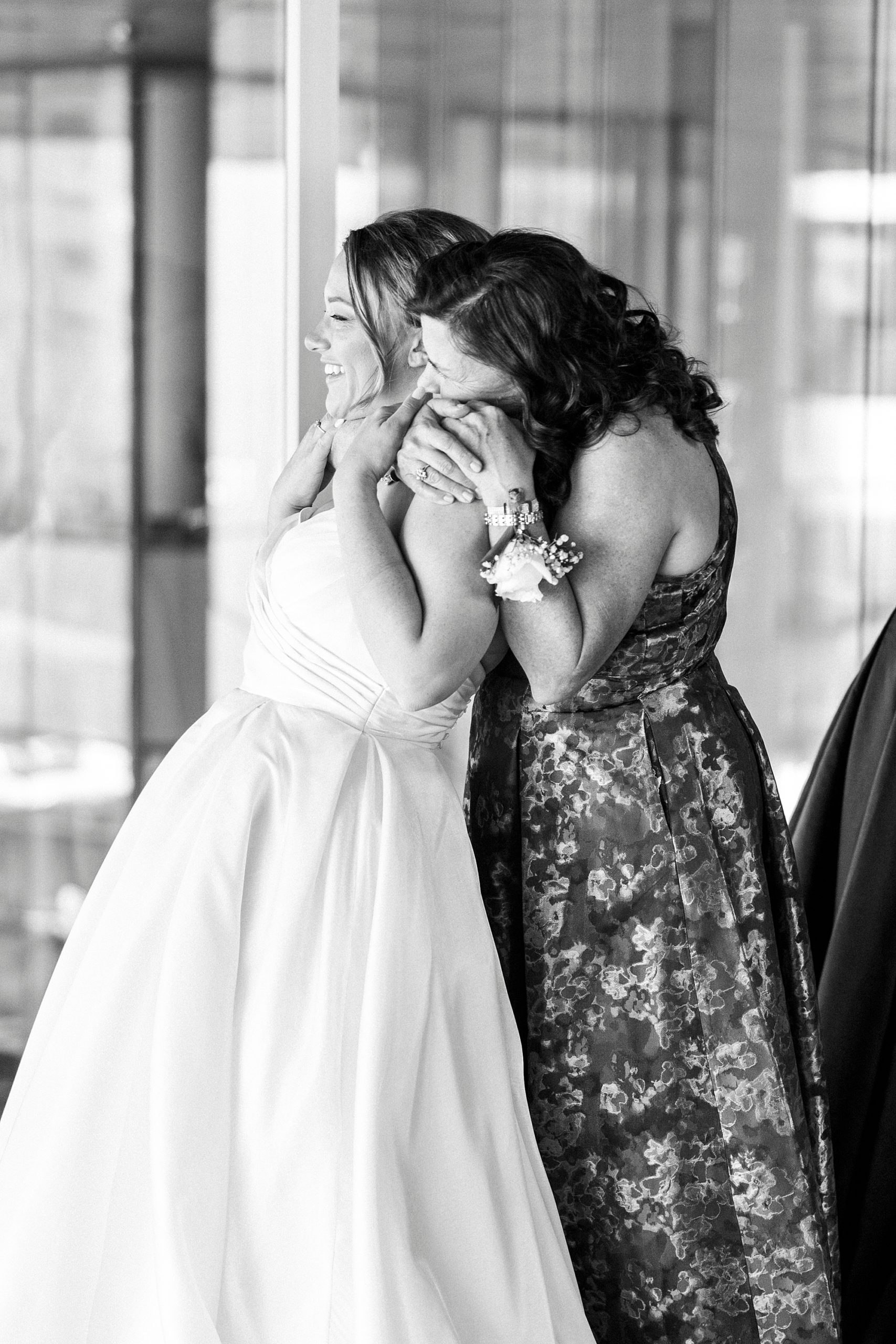 family hugs bride after wedding day prep