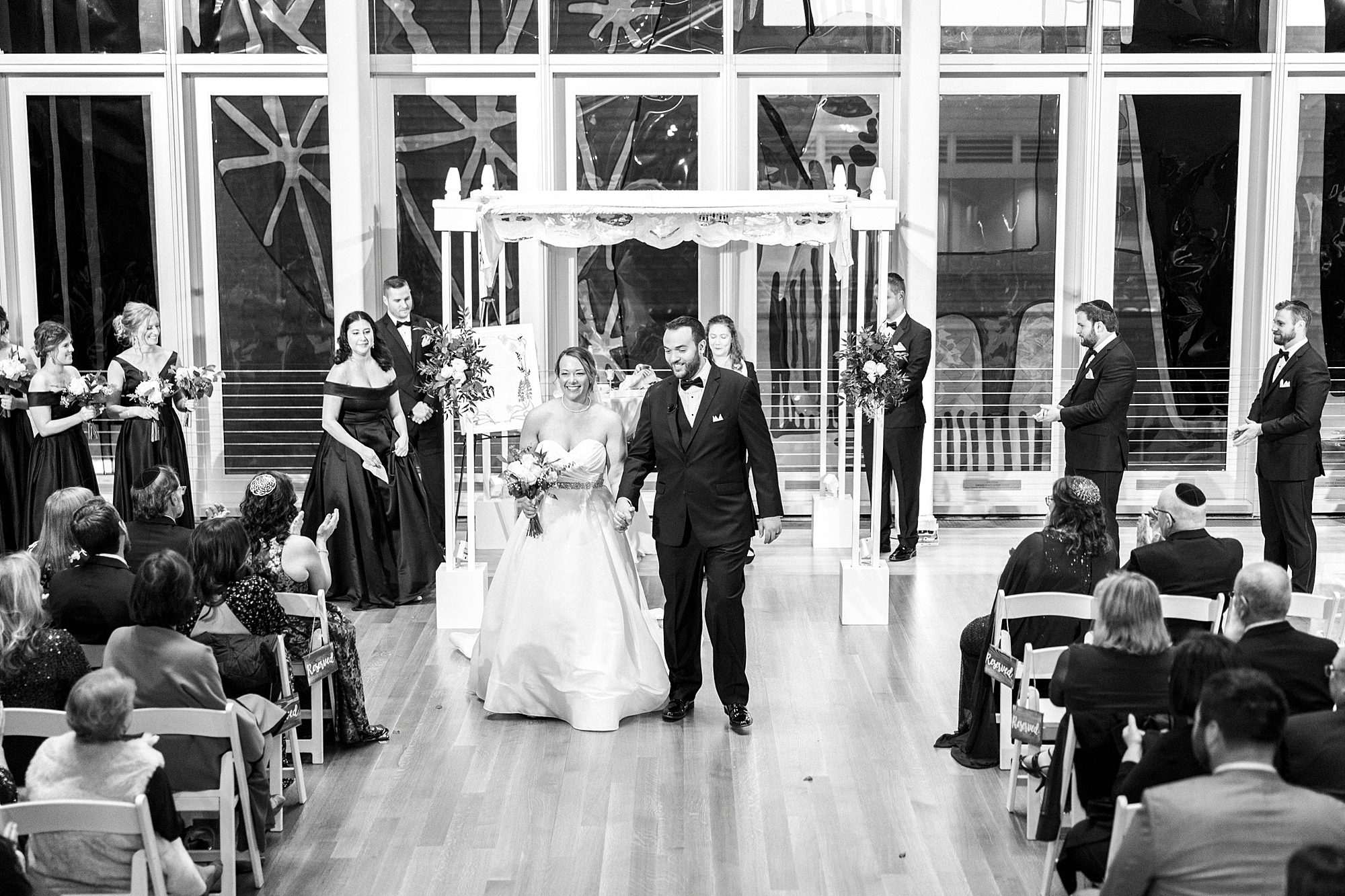 newlyweds leave Jewish wedding ceremony