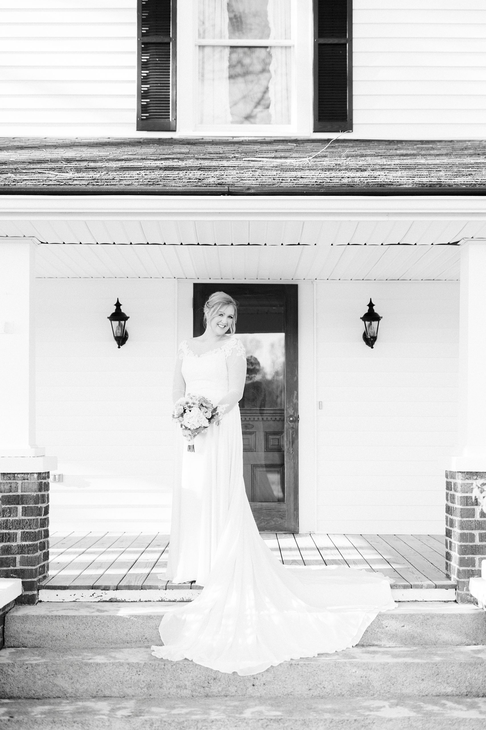 black and white bridal portraits on NC farmhouse steps