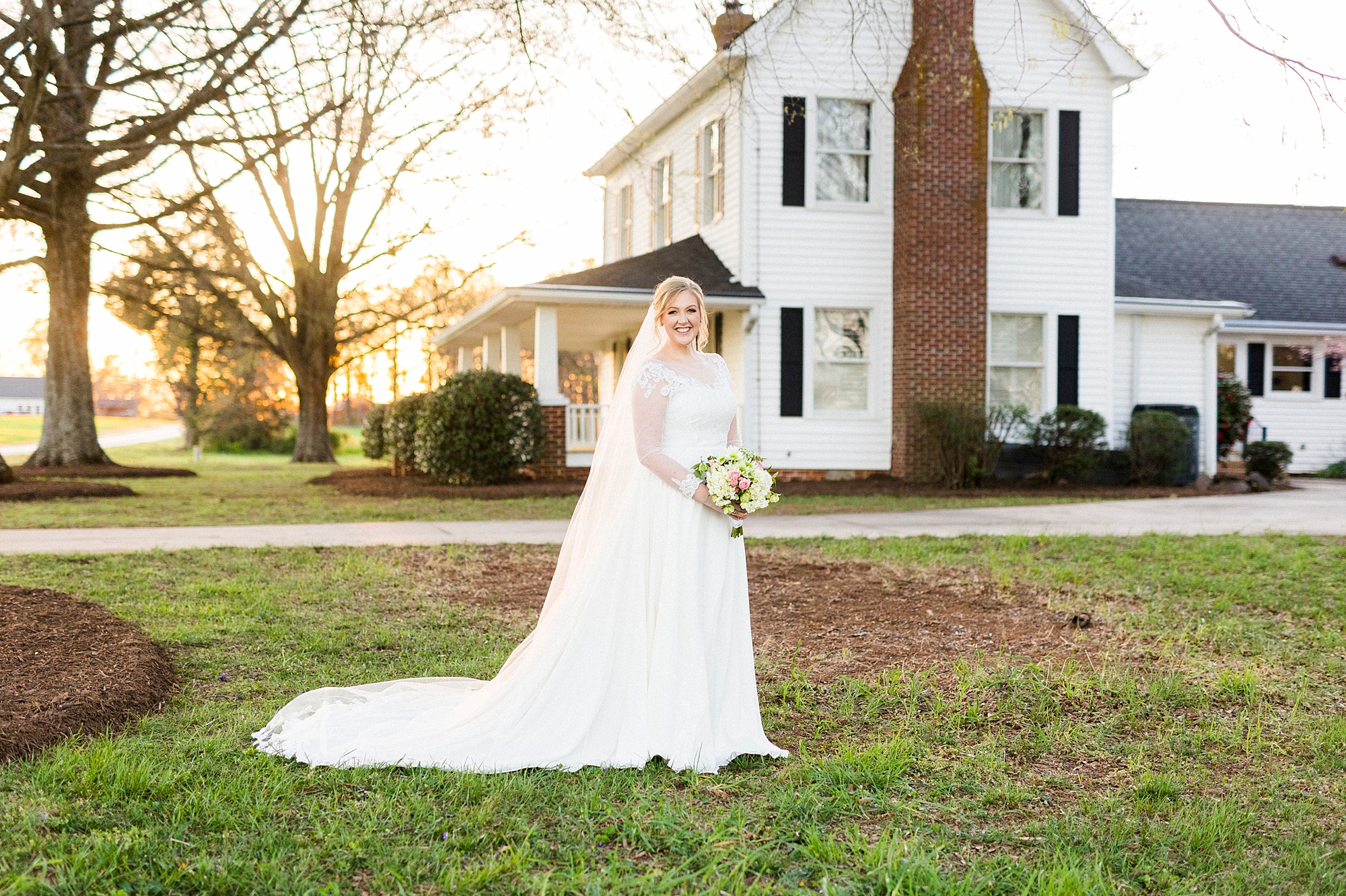 sunset bridal portraits in front of old farmhouse
