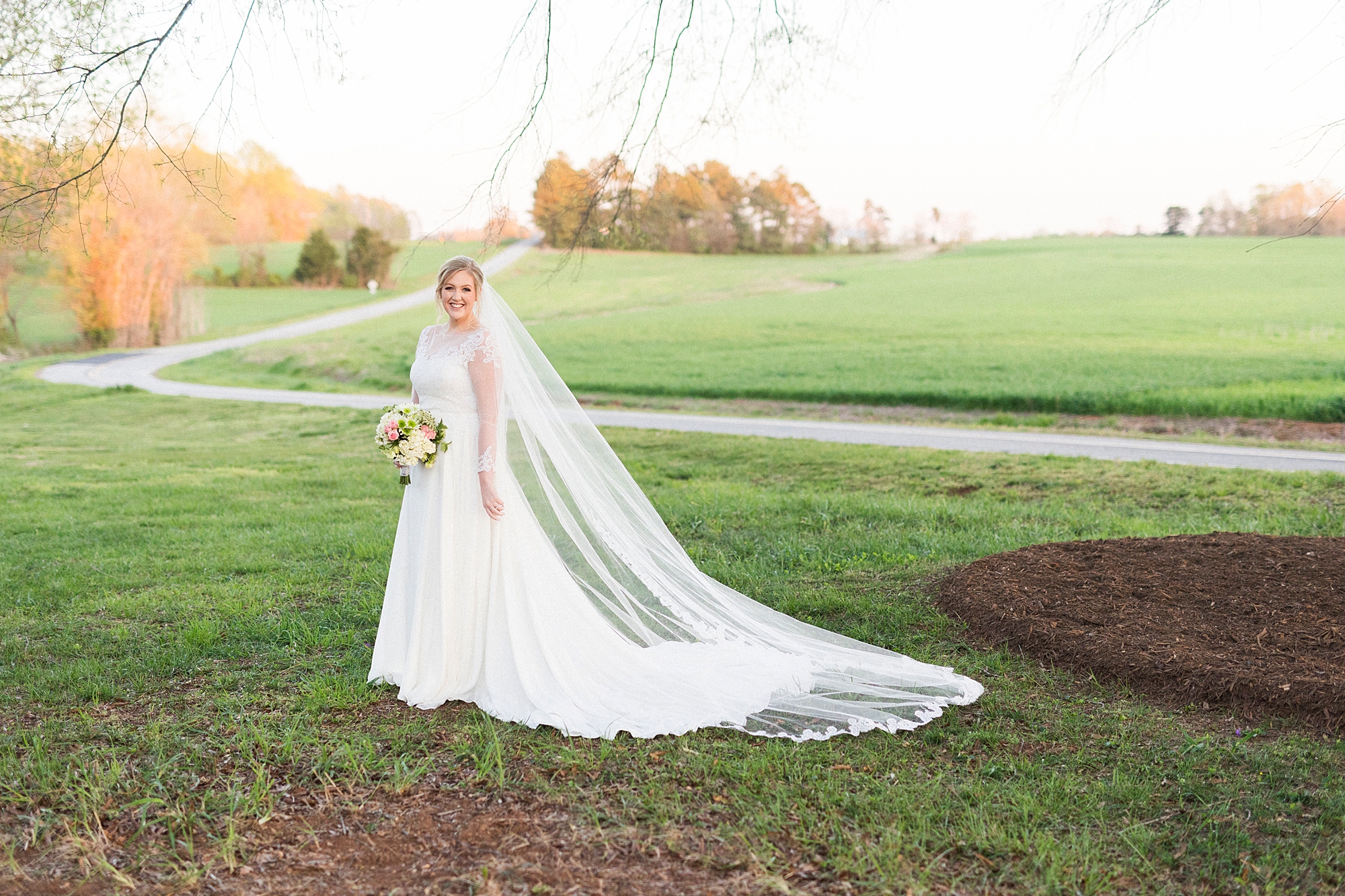 bride walks across lawn at Mooresville bridal portraits