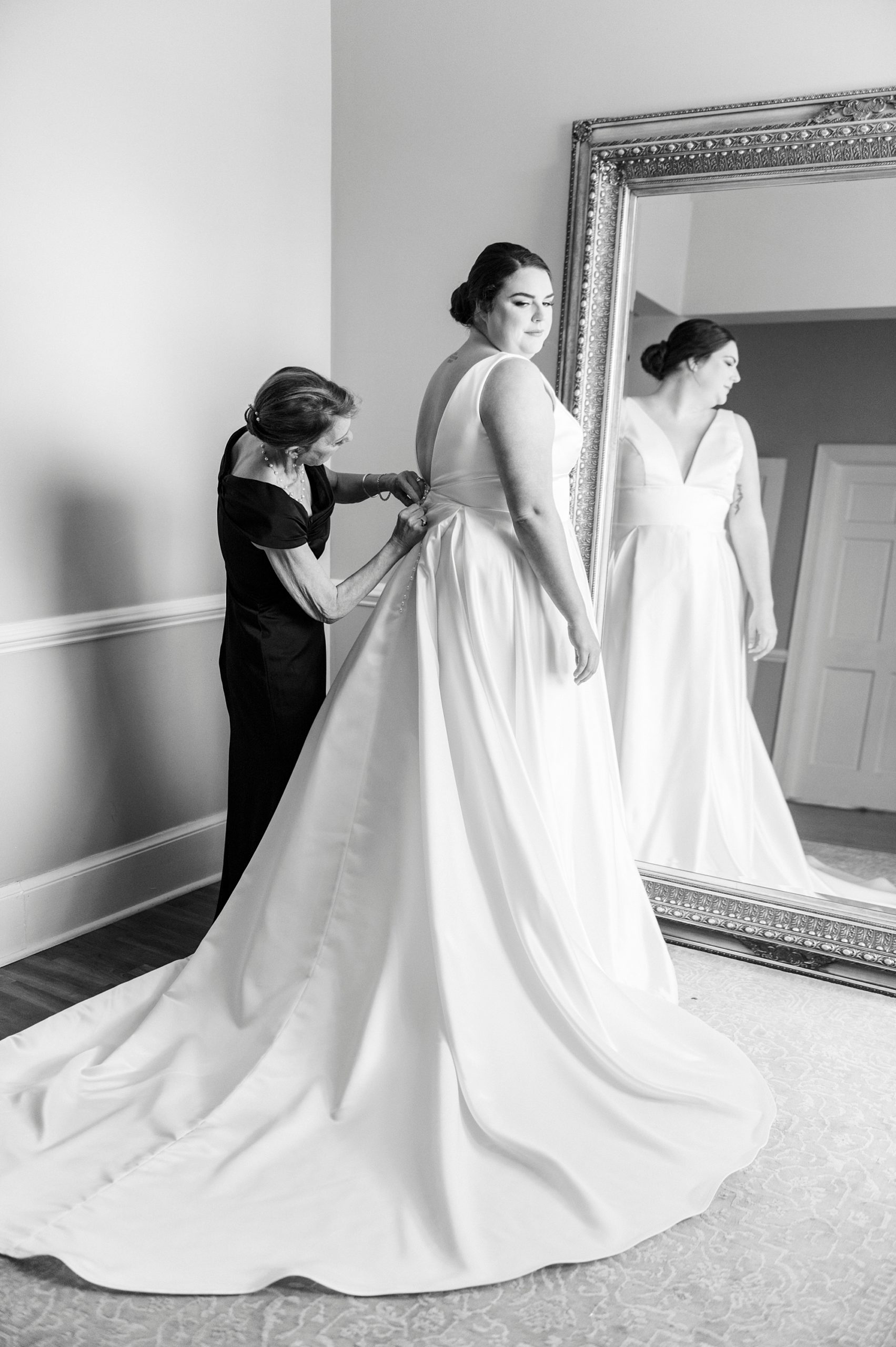 bride prepares for wedding day with mom