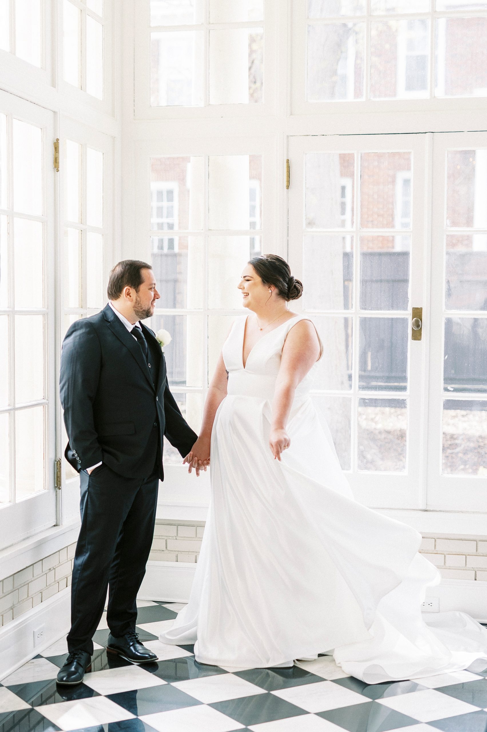 bride twirls wedding dress skirt during portraits at Separk Mansion
