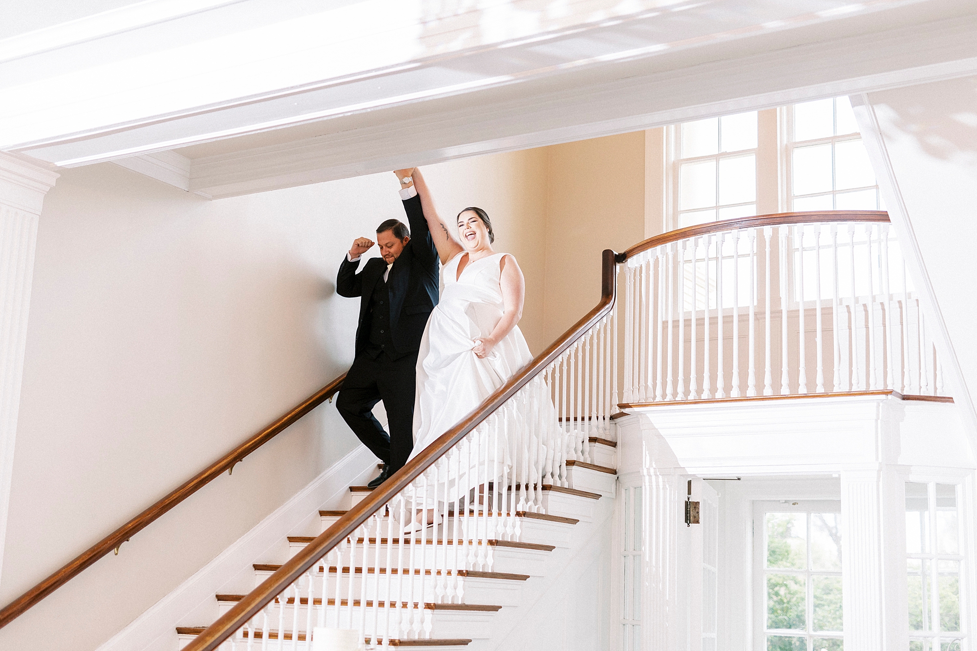 bride and groom walk down steps at the Separk Mansion