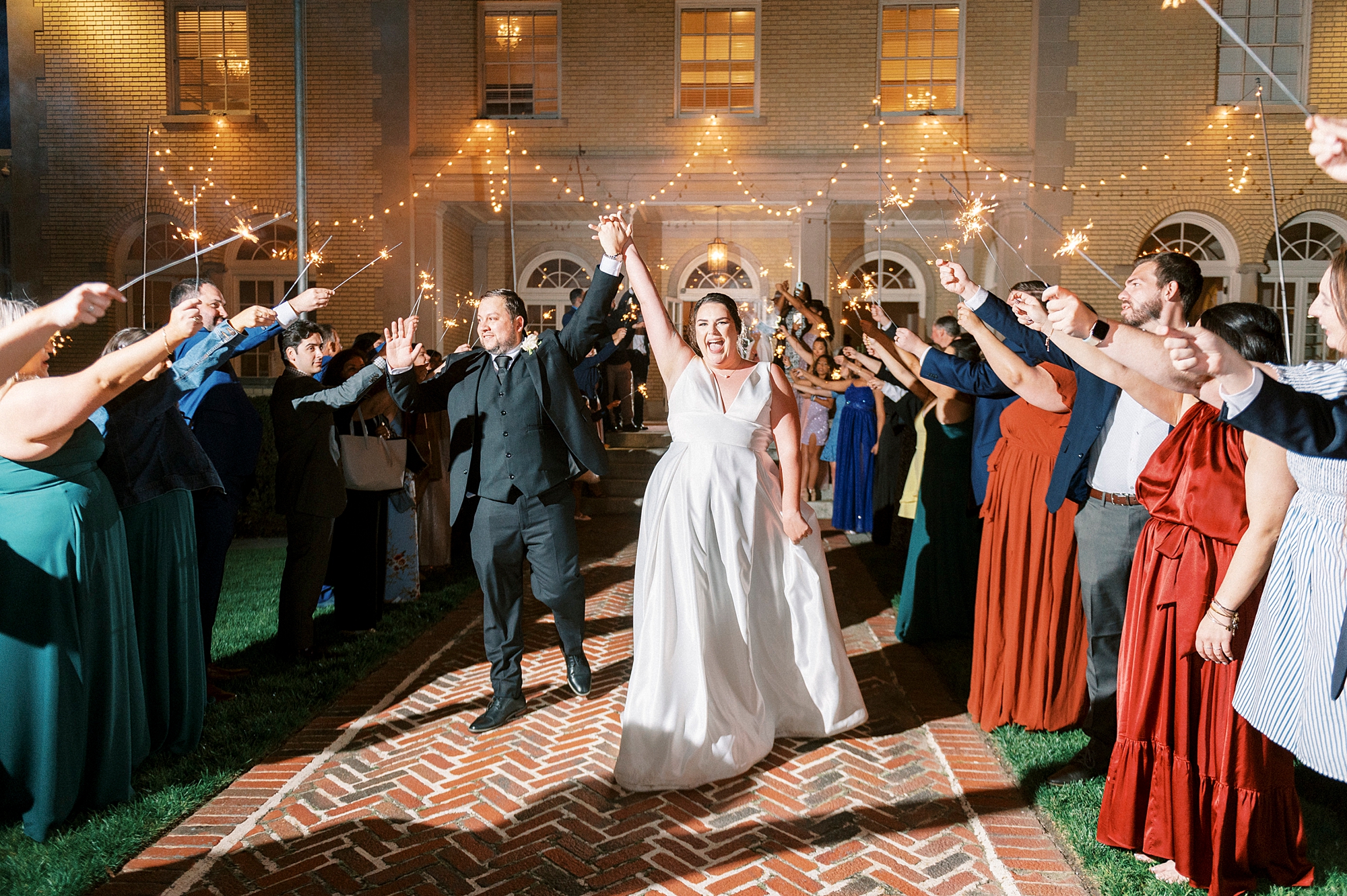 bride and groom walk out through sparkler exit at Separk Mansion