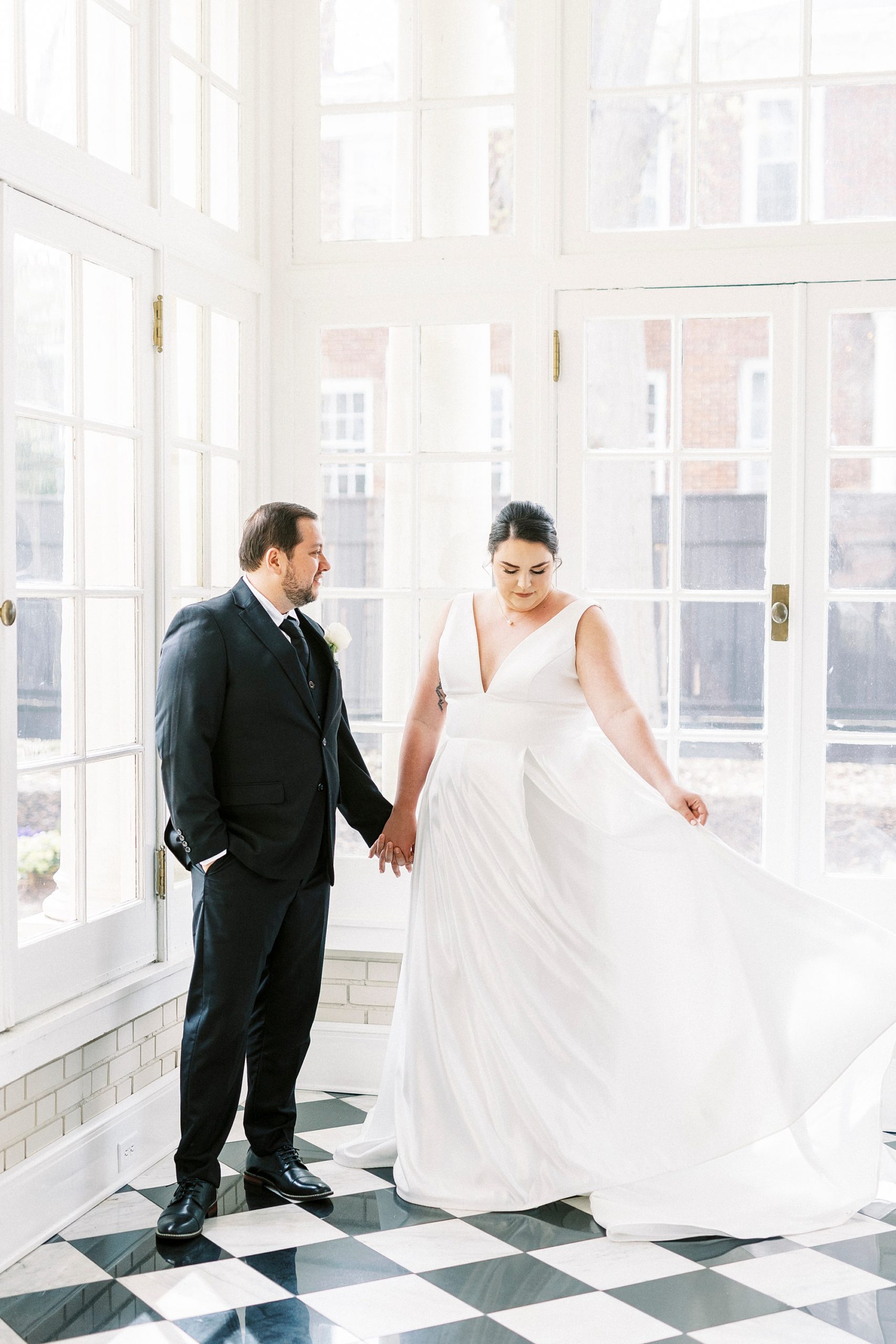 bride swishes skirt of wedding dress at Separk Mansion