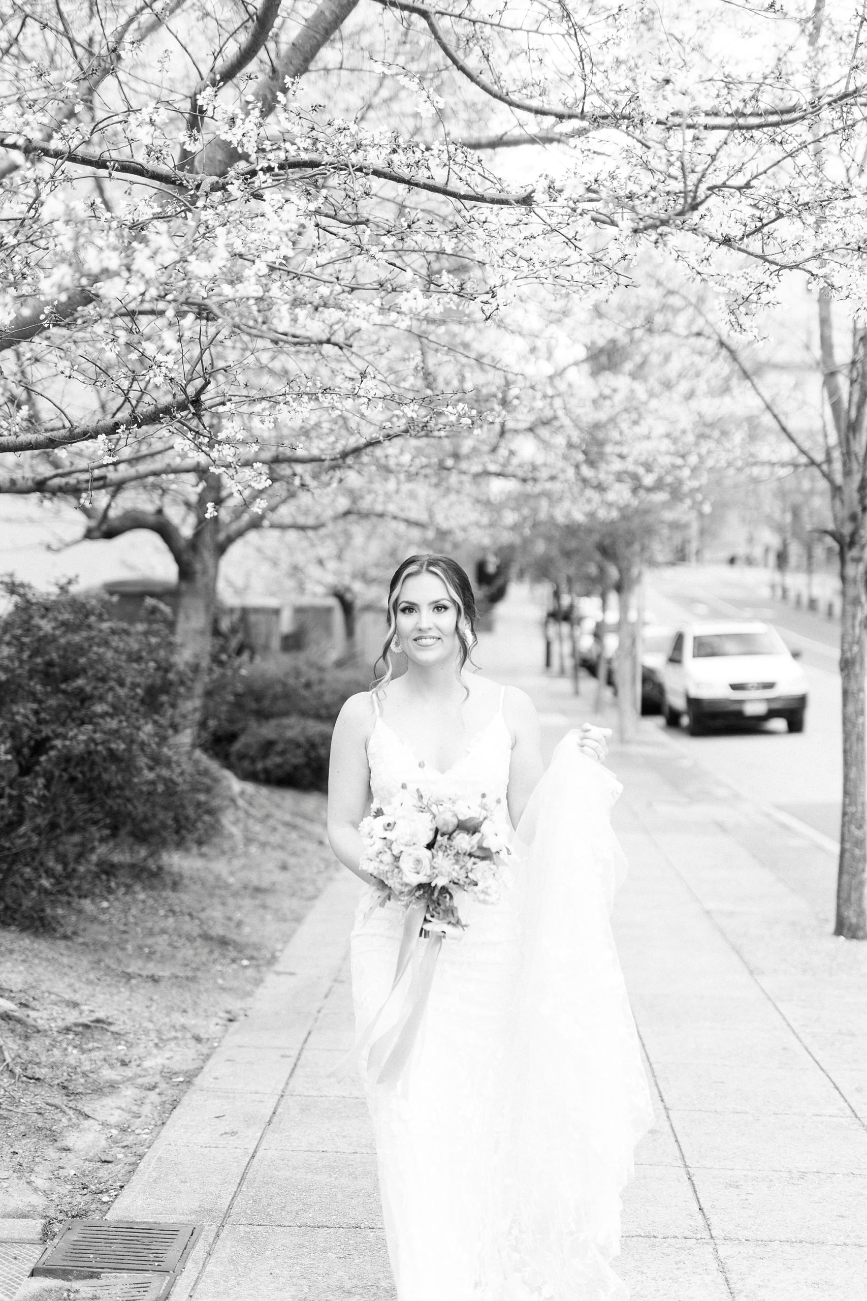 bride walks to first look along street in Raleigh NC