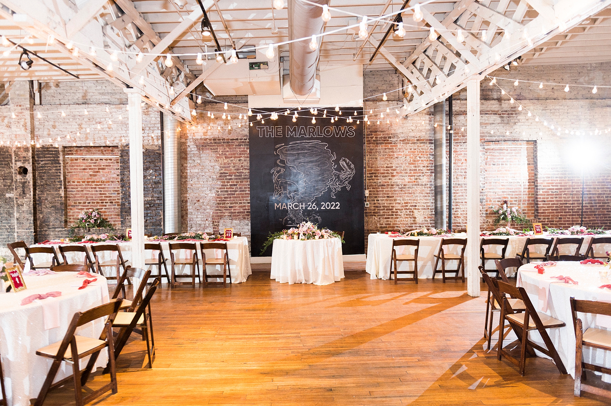 wedding reception with family style seating at Stockroom at 230