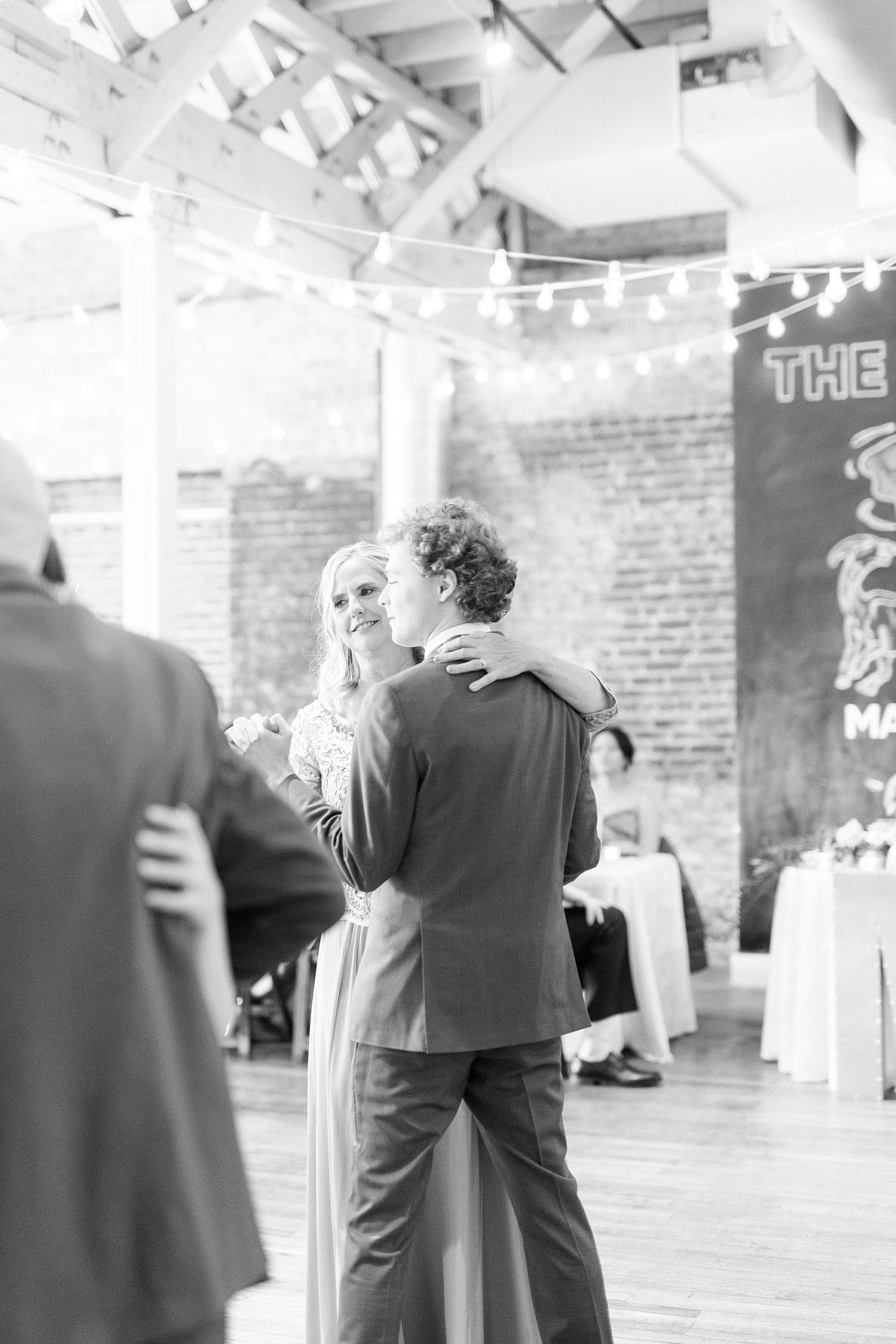groom and mom dance during Raleigh NC wedding reception
