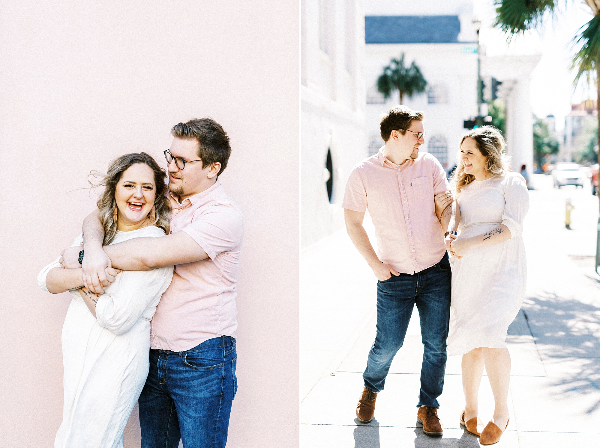 couple hugs against pink wall on Rainbow Row in downtown Charleston