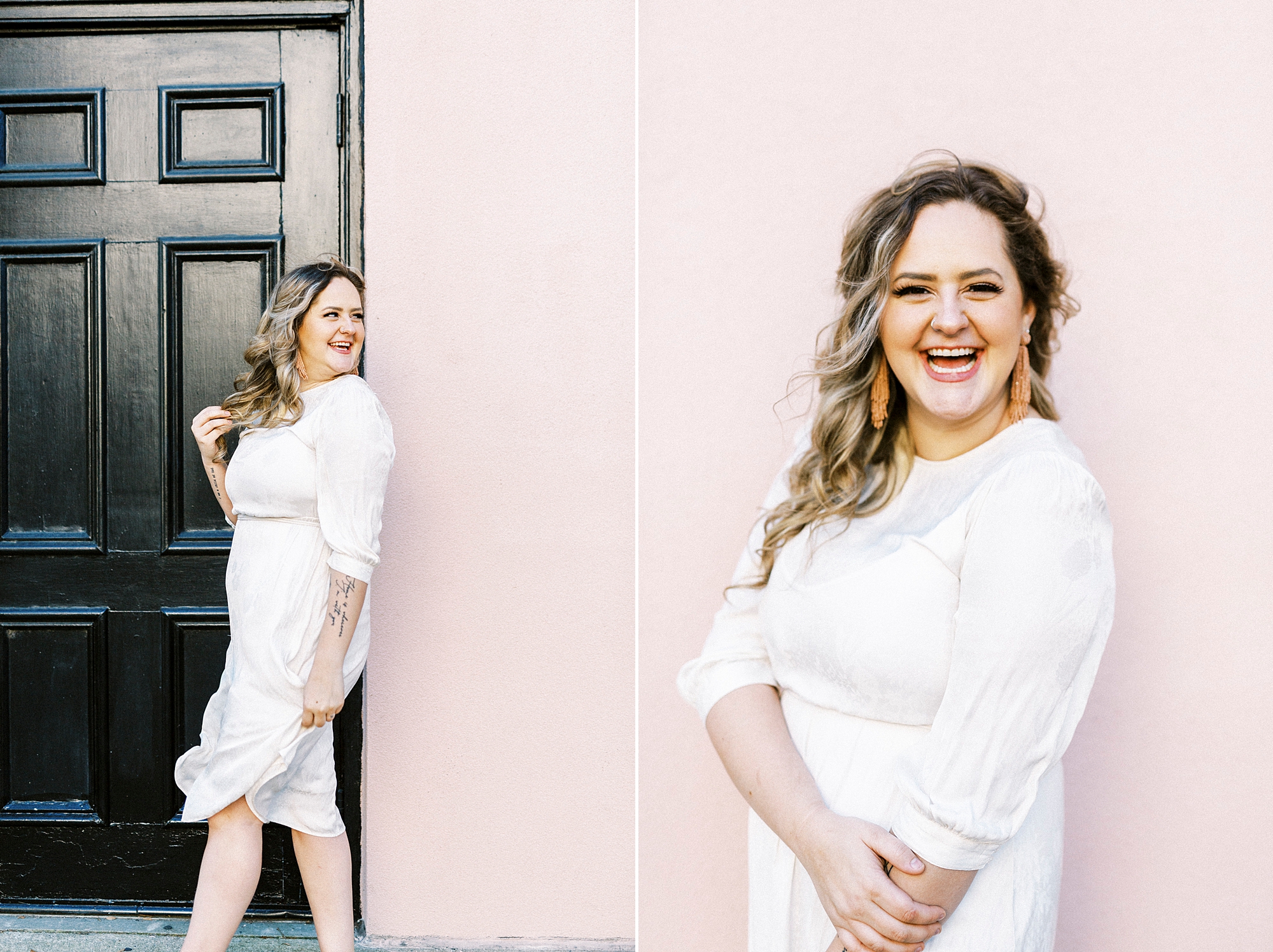 woman in white dress laughs against pink wall in Charleston SC