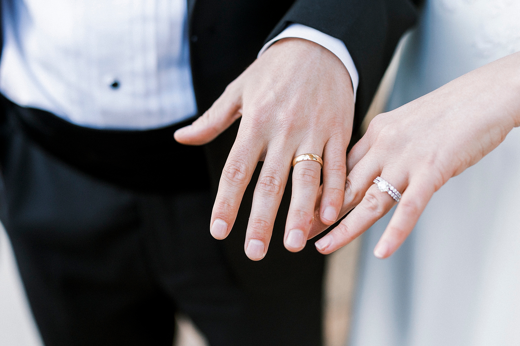 newlyweds show off wedding rings