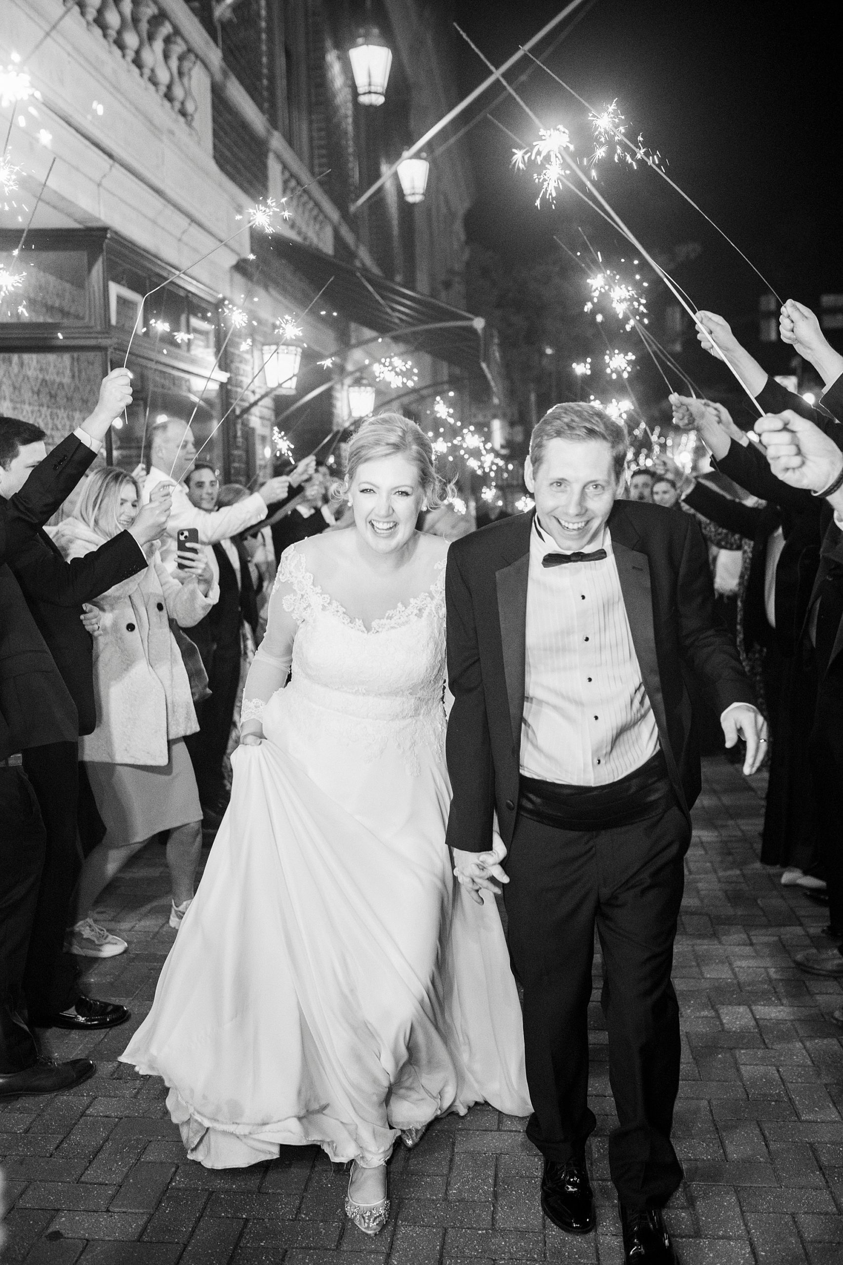 newlyweds run through sparkler exit at Concord NC wedding reception