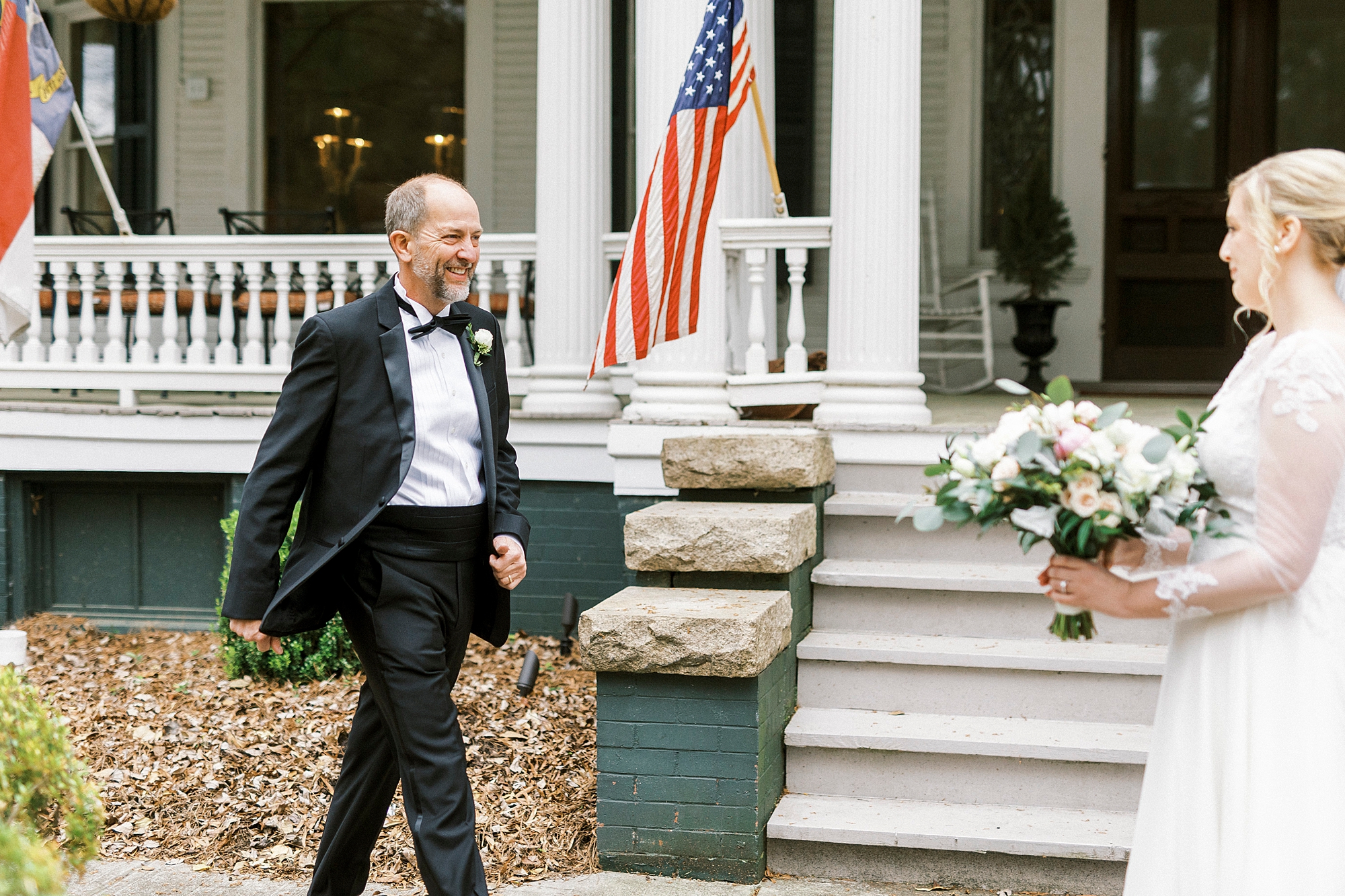 bride and dad have first look by historic home in Concord NC