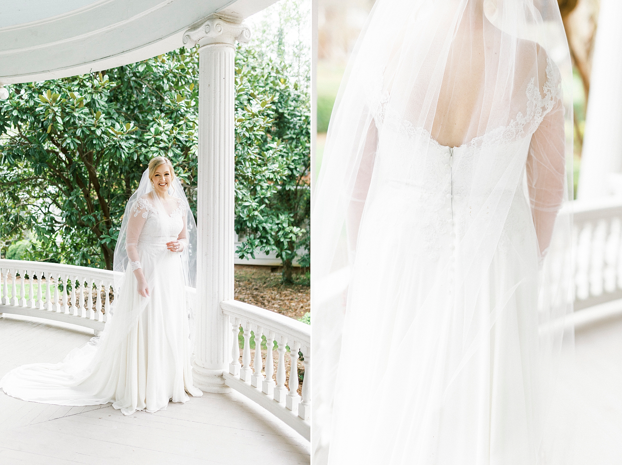 bride stands on front veranda of home with veil around shoulders 