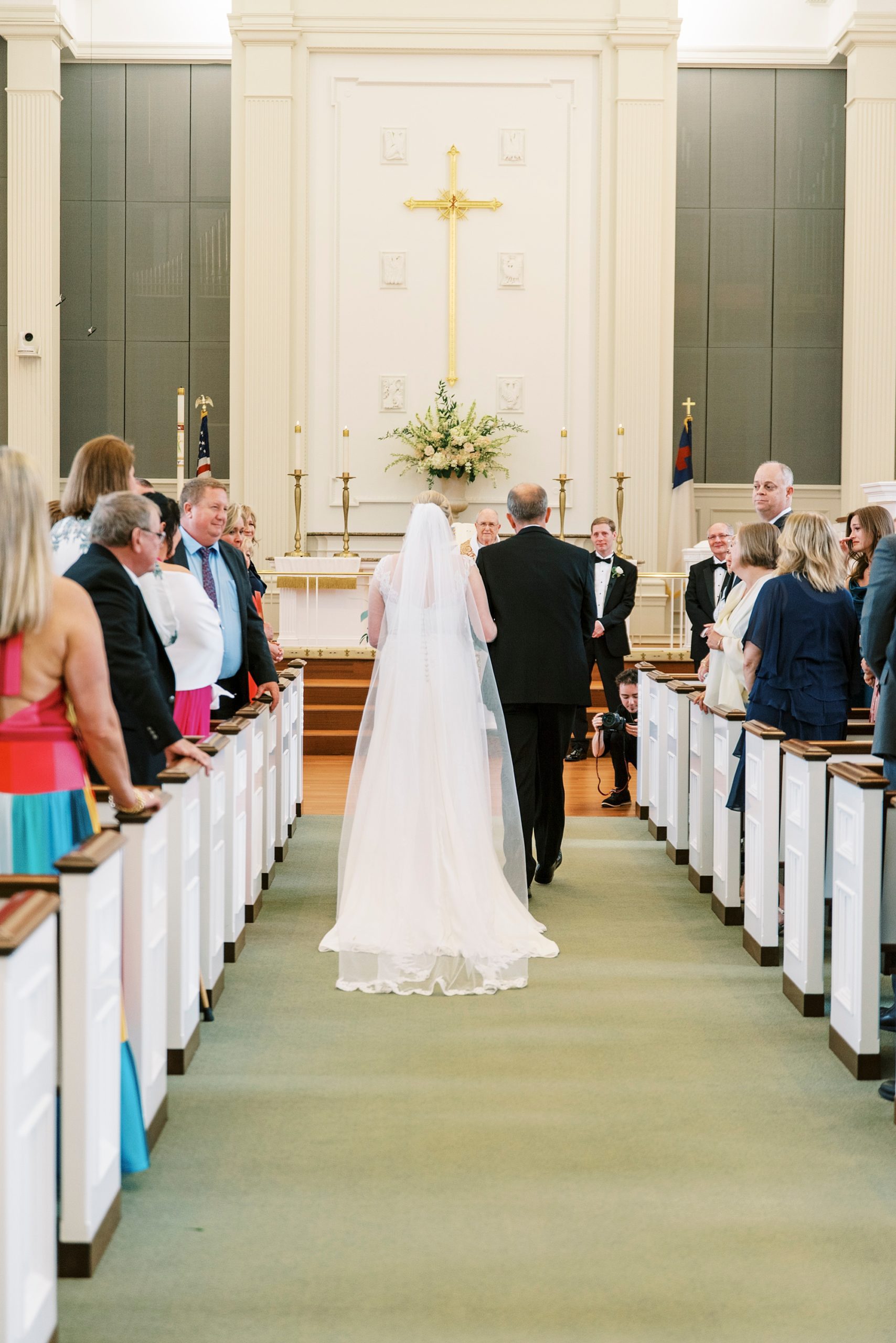 bride and dad enter traditional church wedding in Concord NC
