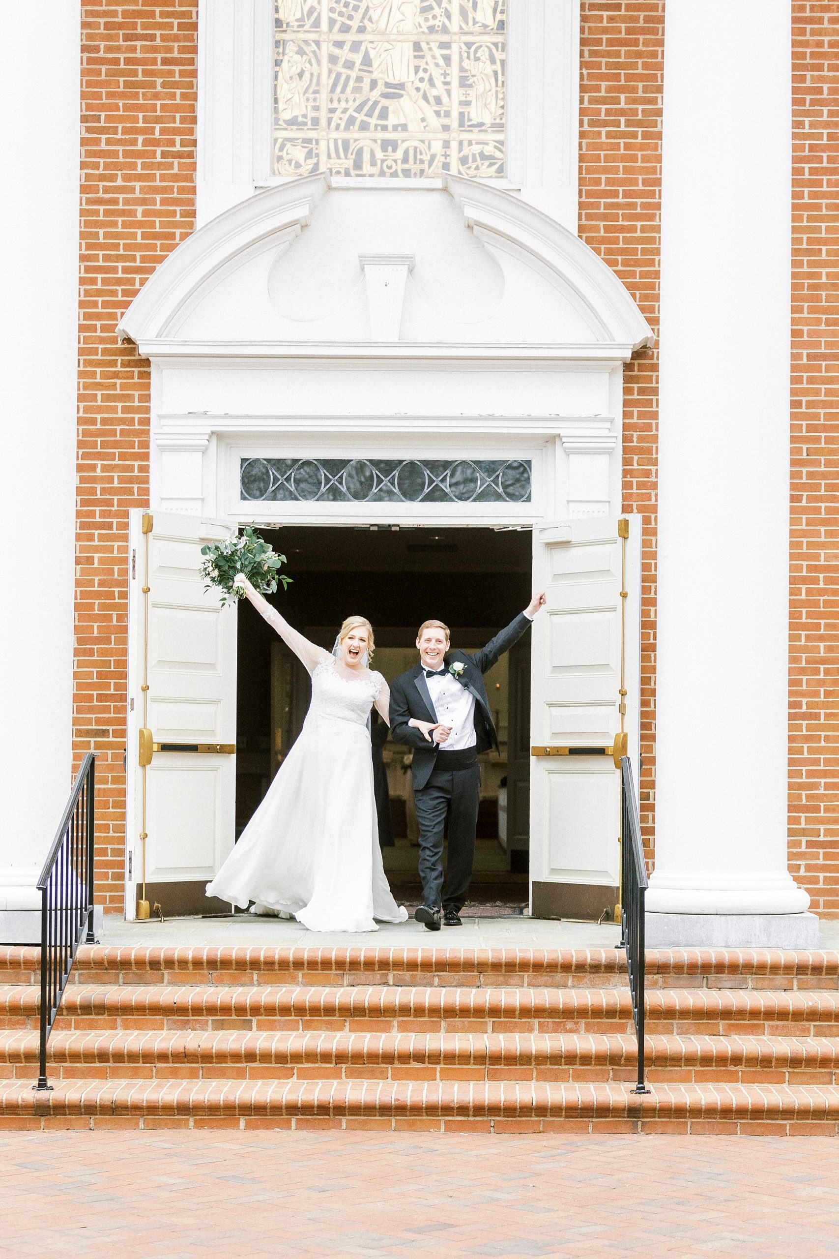 newlyweds cheer out door of church 