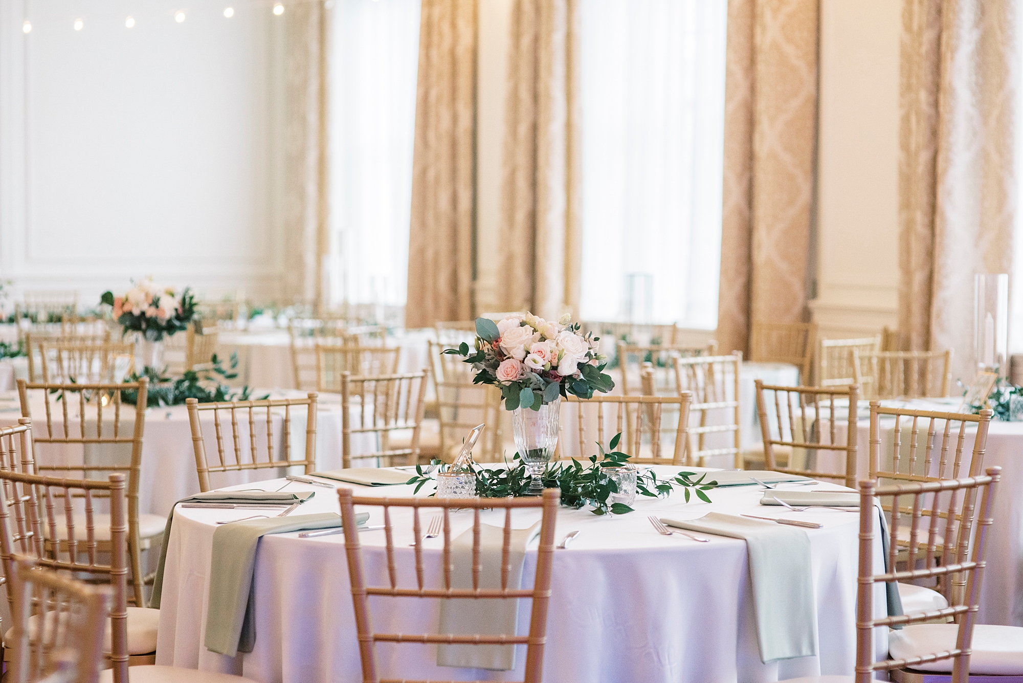 Hotel Concord wedding with gold chivari chairs