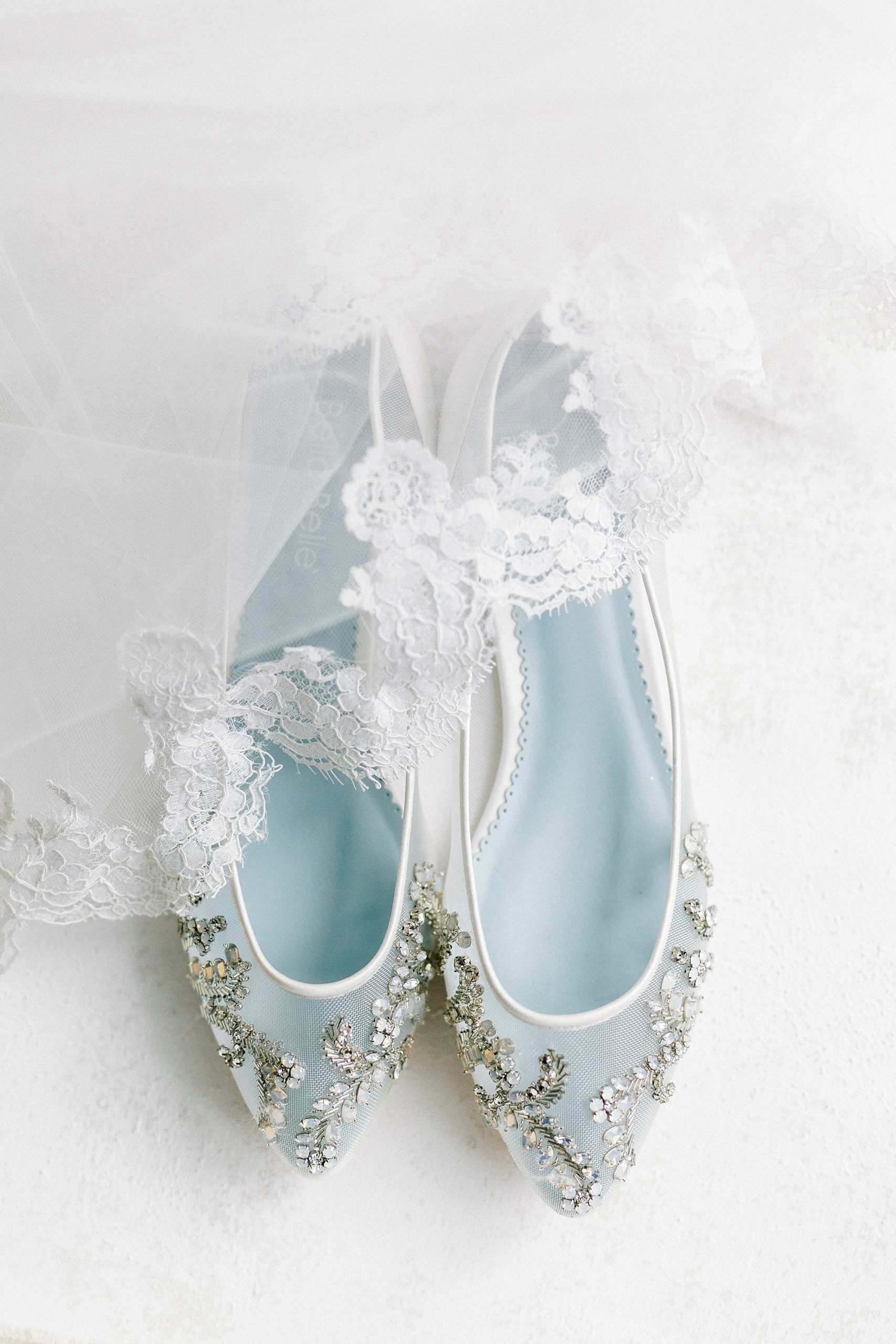 bride's shoes with blue soles