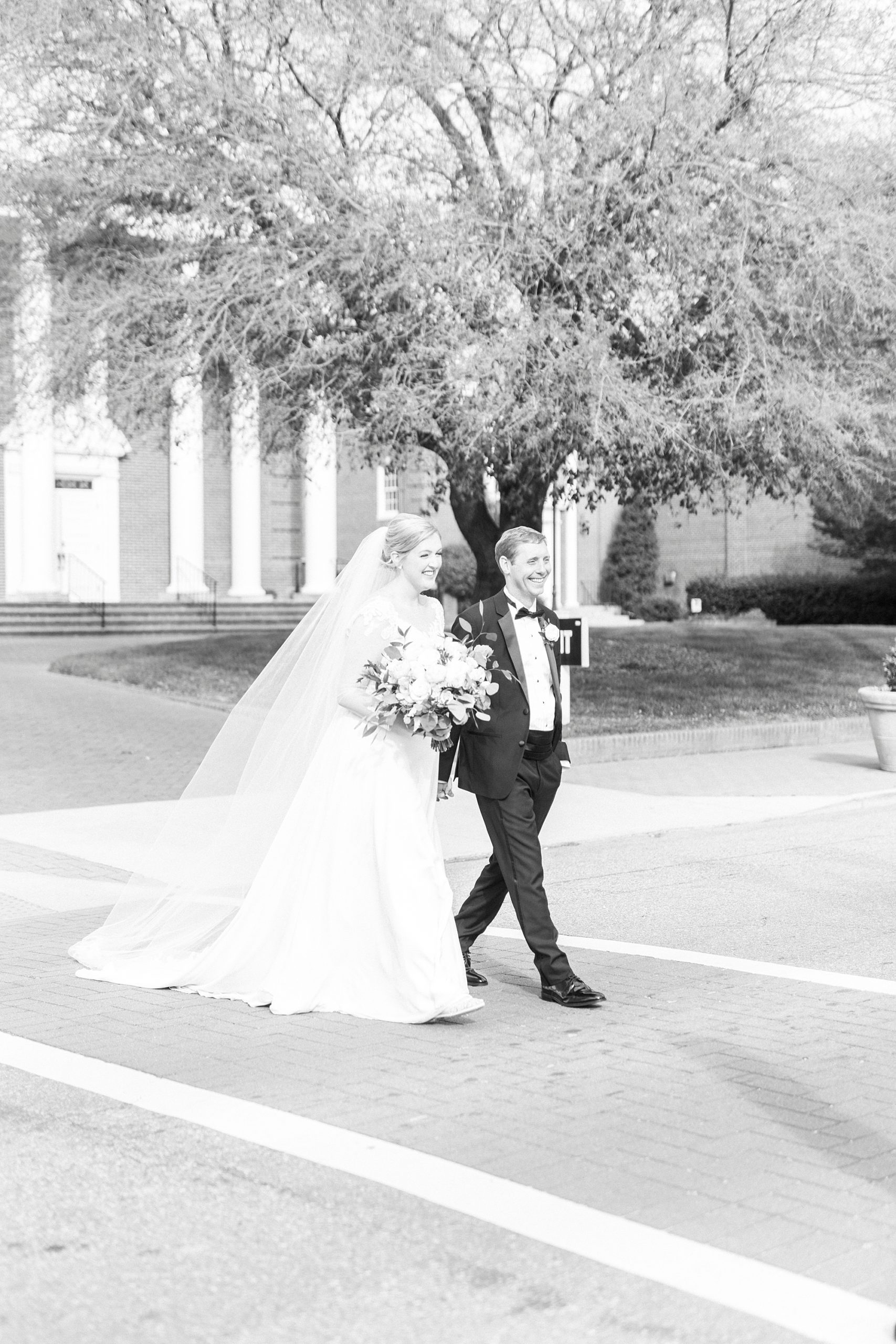 newlyweds walk across street in Concord 