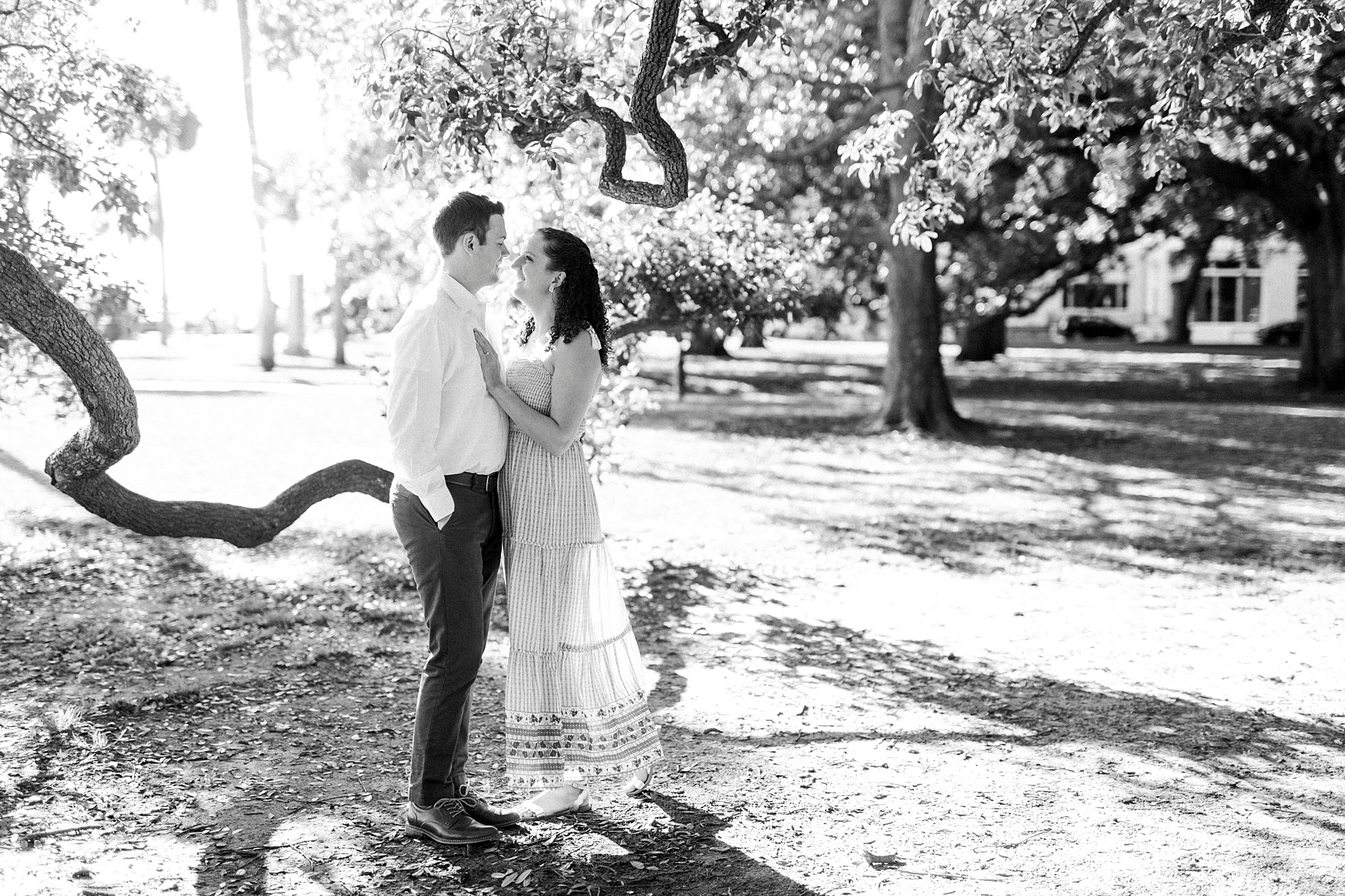 married couple poses by tree in Washington Park