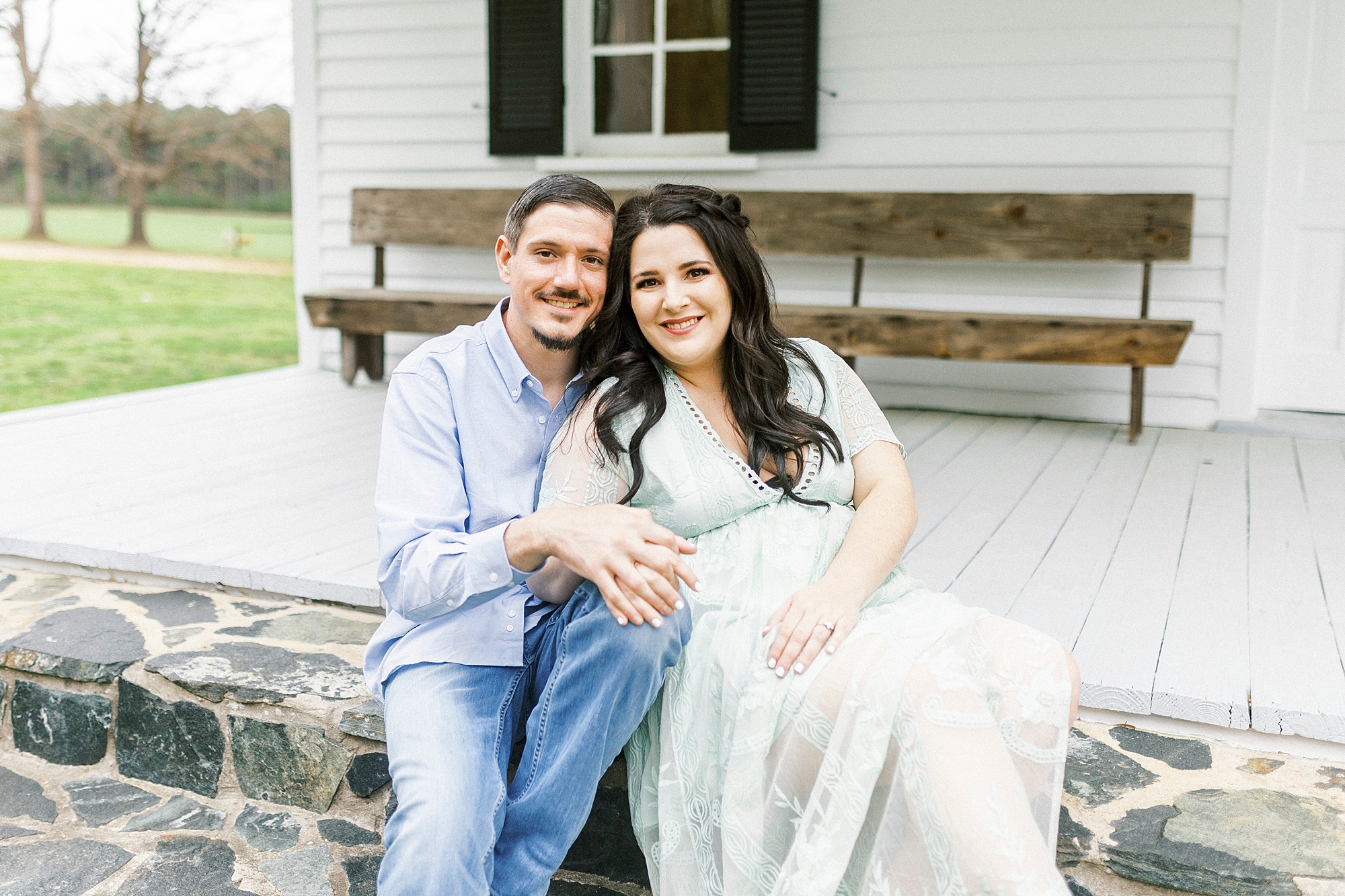 couple sits on steps of Troutman NC chapel