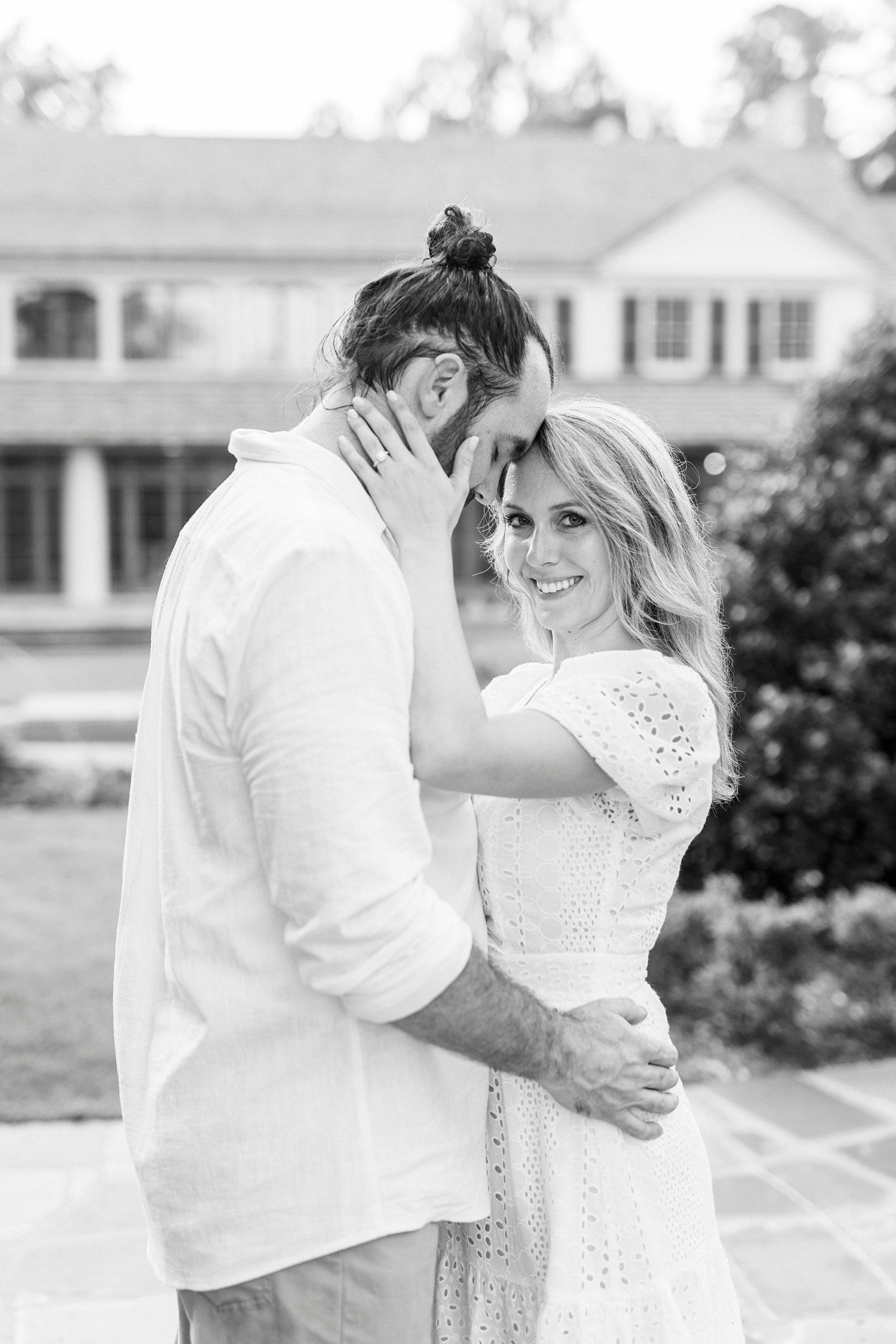 groom leans head into bride's forehead during NC engagement photos