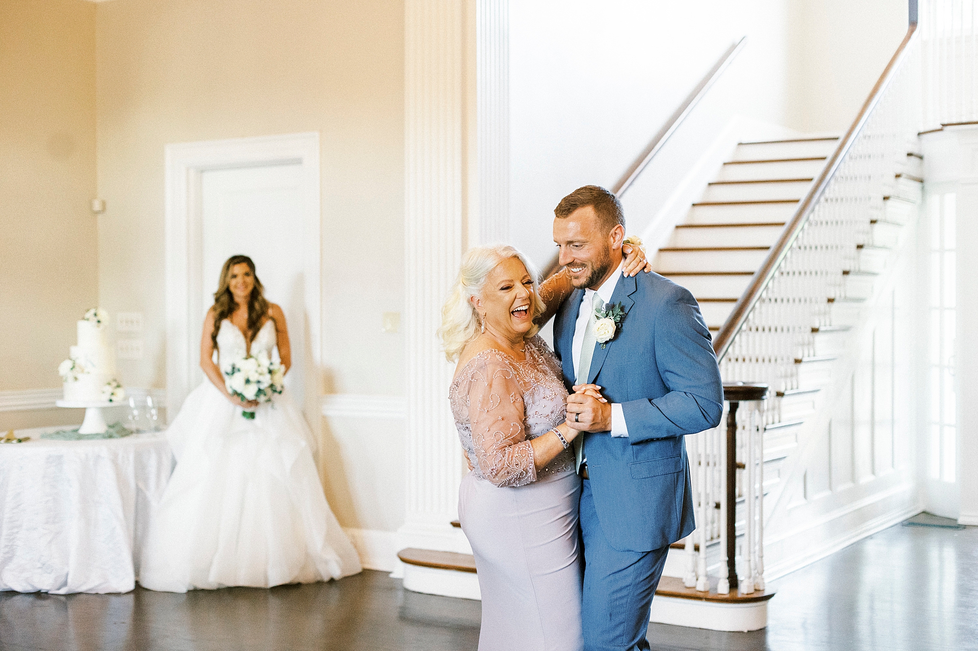 groom and mom dance while groom watches at Separk Mansion